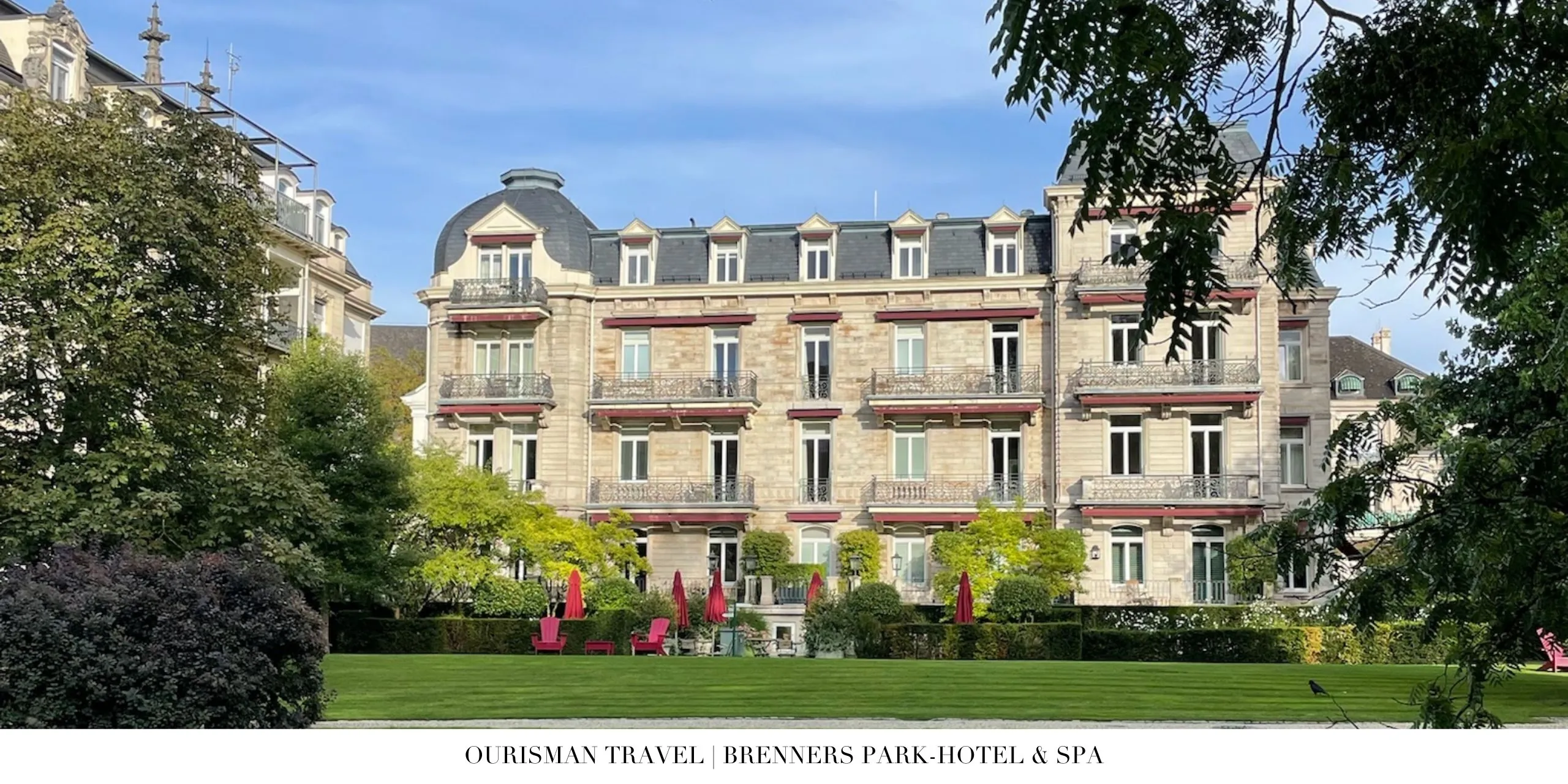 Historic façade of Brenners Park-Hotel & Spa surrounded by landscaped gardens