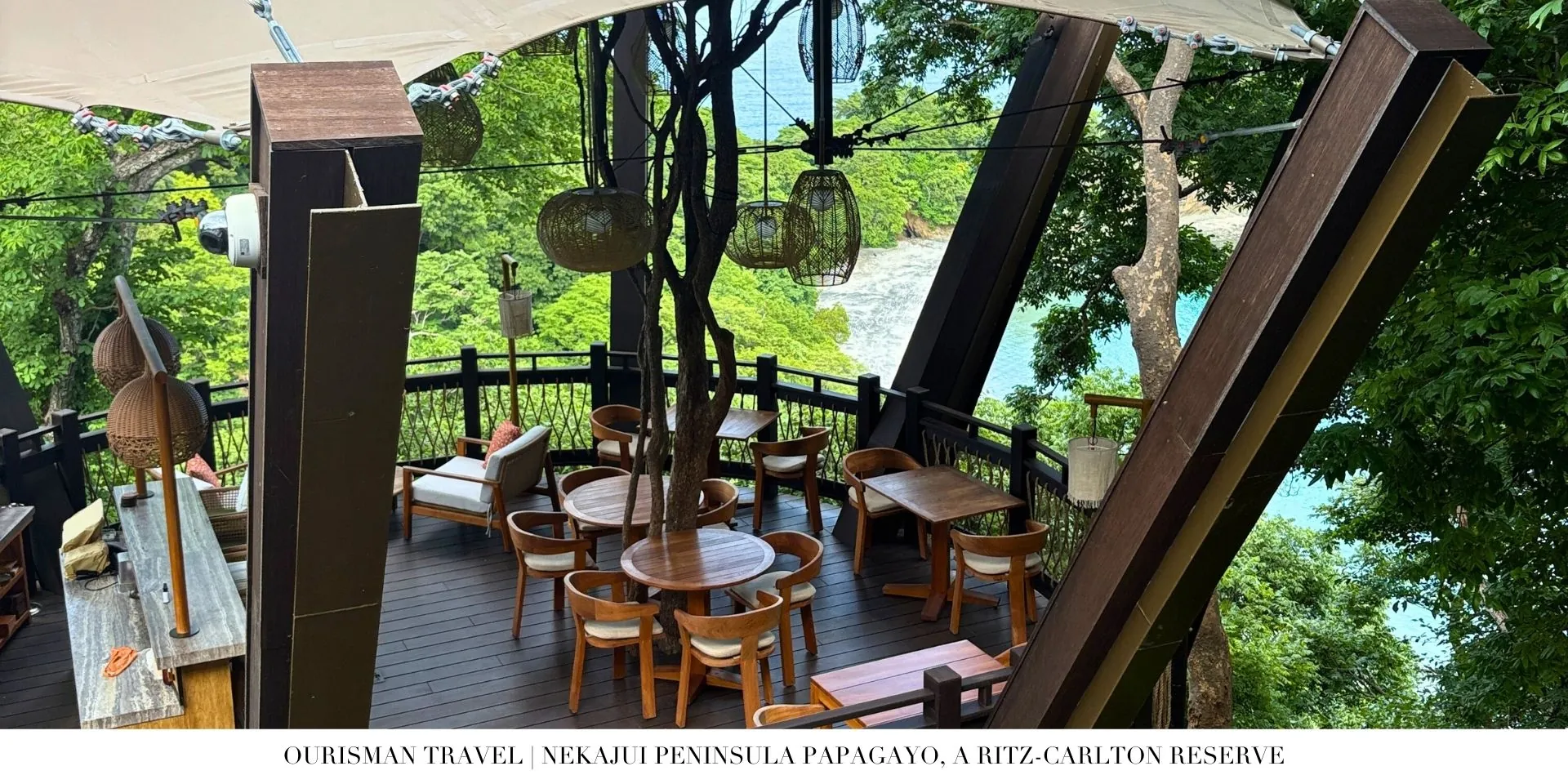 Treetop bar at Nekajui, a Ritz-Carlton Reserve, offering elevated ocean views and a lush tropical setting