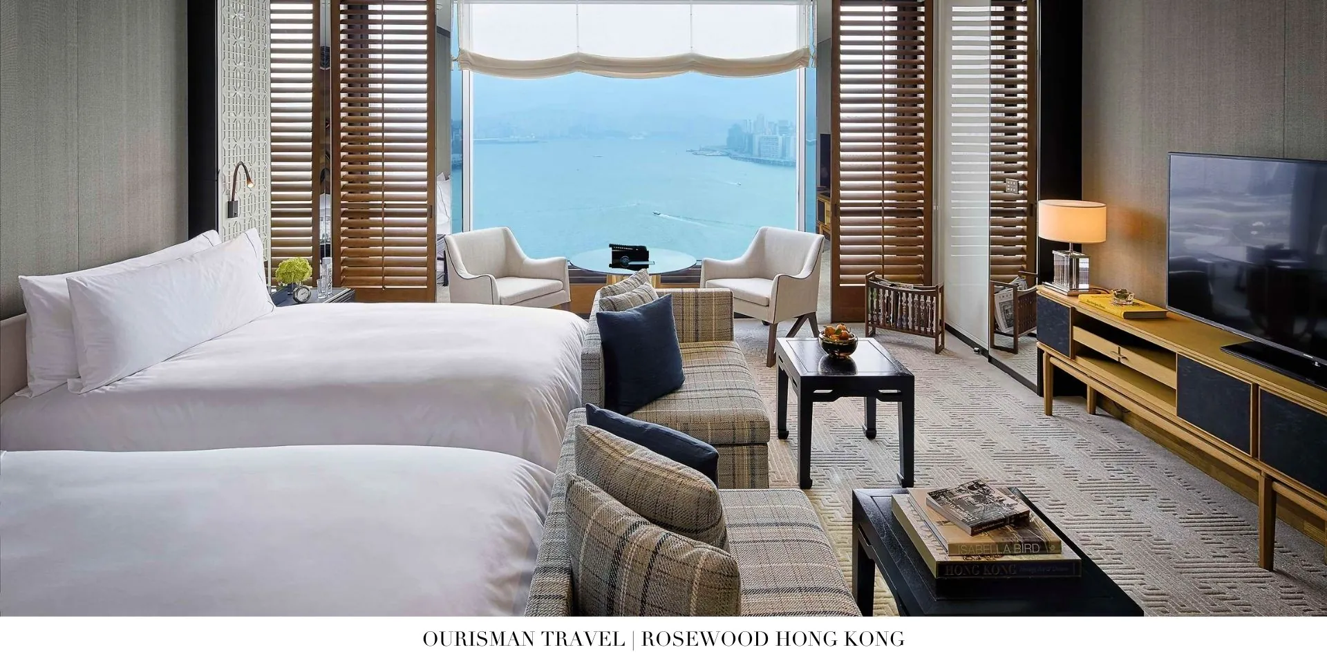 Guest room at Rosewood Hong Kong with plush furnishings and contemporary décor
