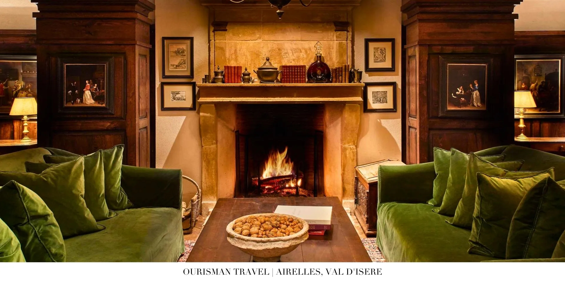 Cozy lounge interior at Airelles, Val d’Isère with fireplace, plush seating, and mountain views