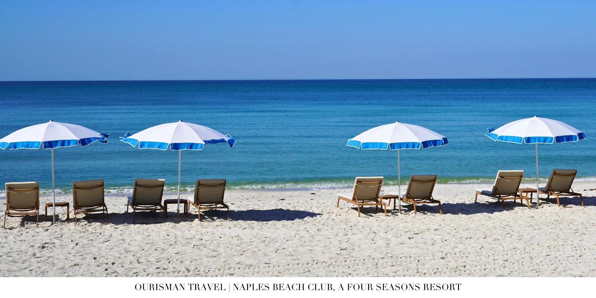 White-sand beach and loungers at Naples Beach Club