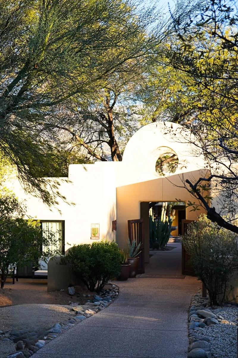 Adobe style building at Miraval Arizona Resort surrounded by desert trees