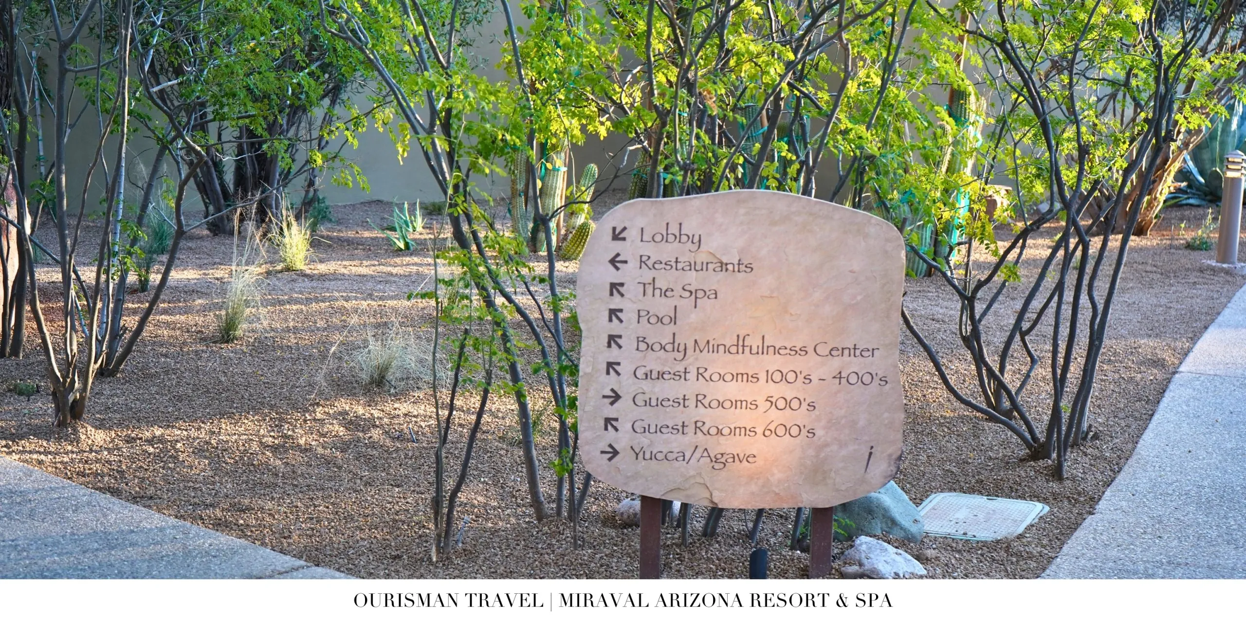 Wayfinding stone sign at Miraval Arizona Resort listing wellness spaces and amenities