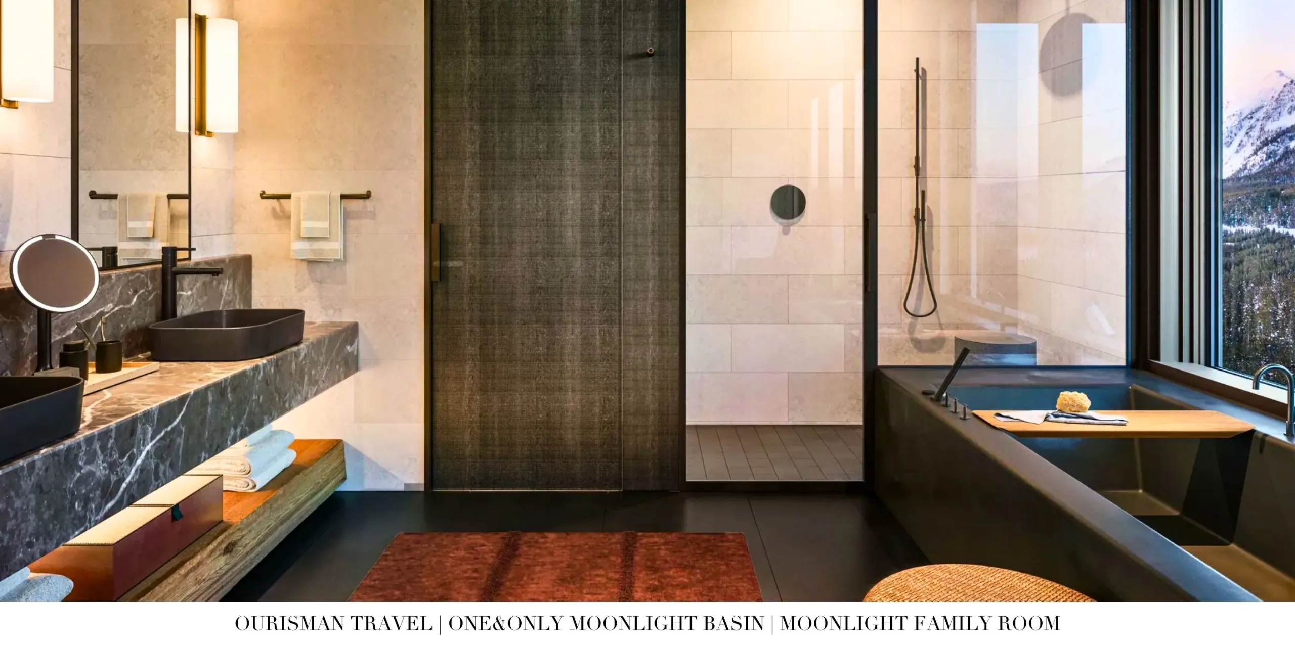 Large bathroom in a family accommodation at One&Only Moonlight Basin with soaking tub, dual vanities, and stone detailing.