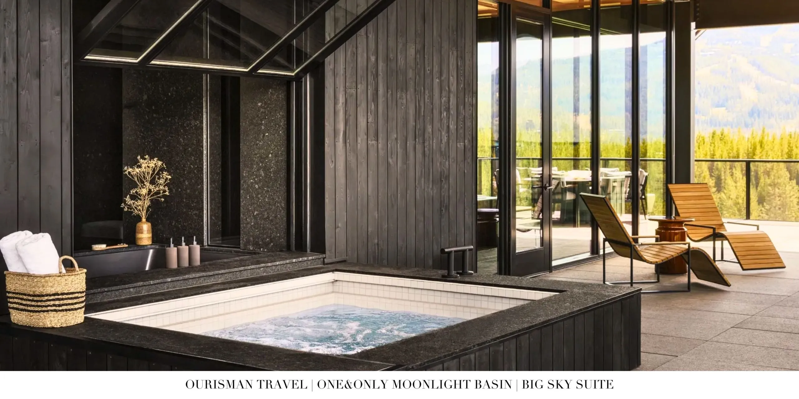 Living room inside the Big Sky Suite at One&Only Moonlight Basin showcasing a stone fireplace, custom furnishings, and refined mountain décor.