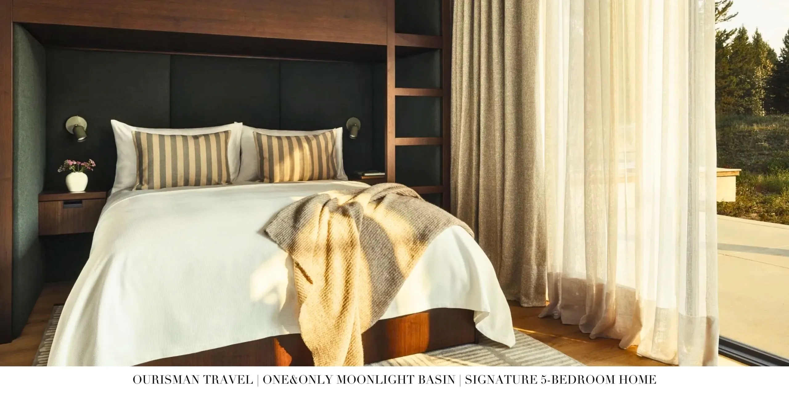 Luxury private residence at One&Only Moonlight Basin with vaulted ceilings, stone fireplace, and floor-to-ceiling windows overlooking the mountains.