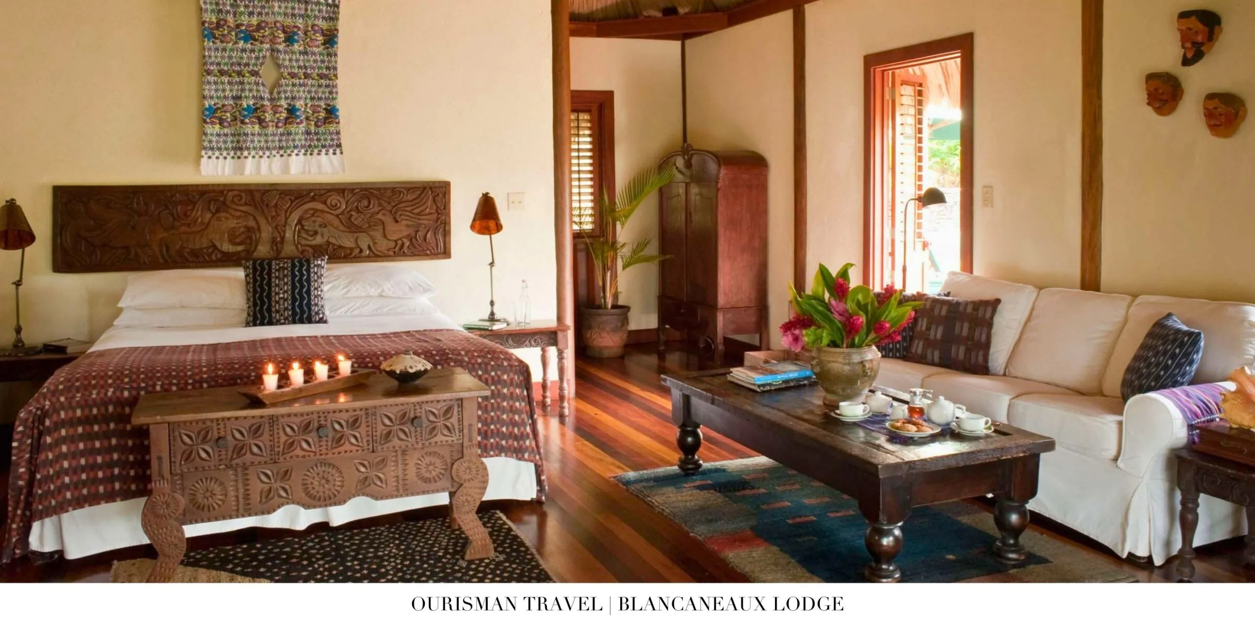 Interior of a luxury suite at Blancaneaux Lodge with rainforest views and tropical décor