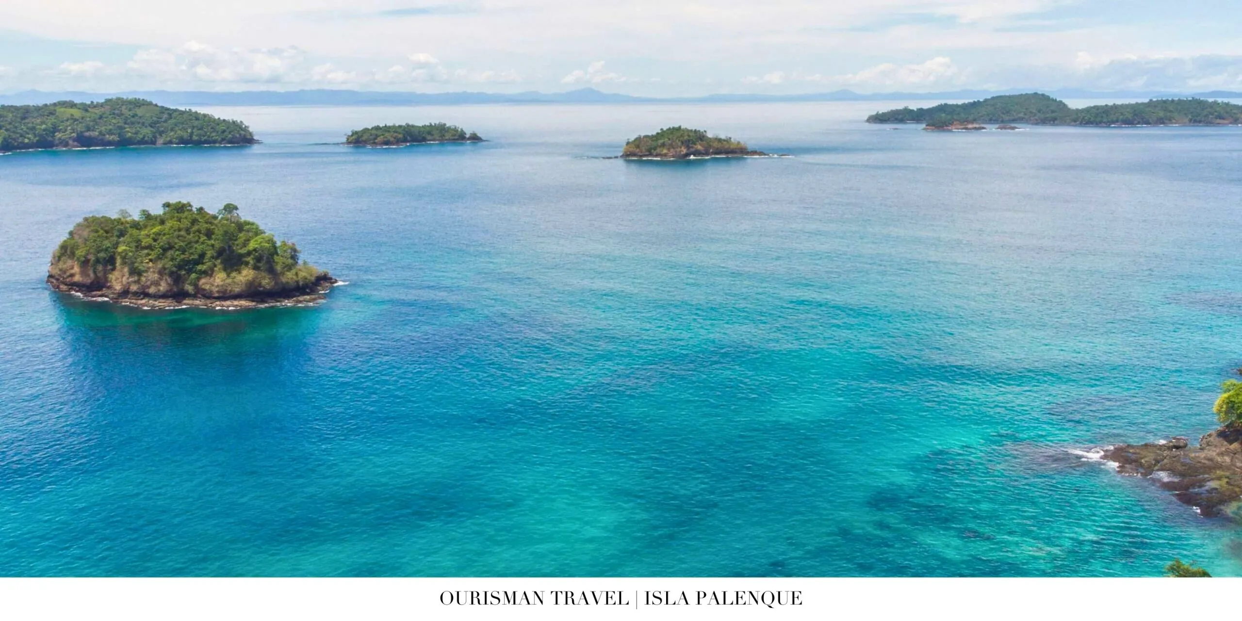 Beachfront lounge at Isla Palenque Resort with soft white sand and turquoise water