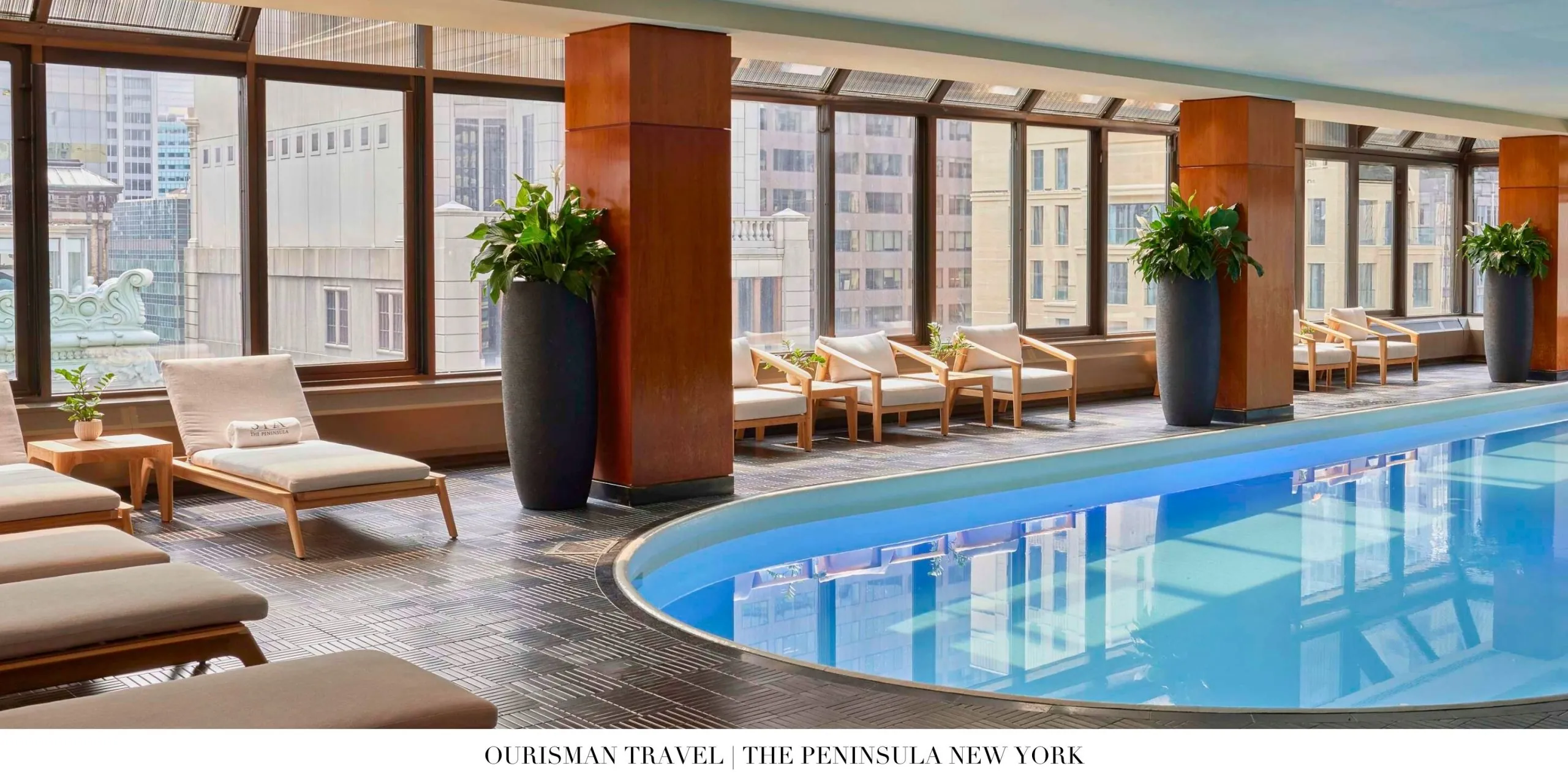 Glass-enclosed indoor pool at The Peninsula New York