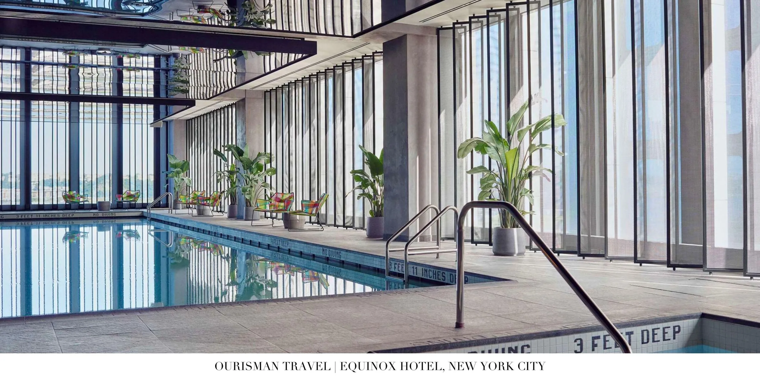 Indoor lap pool with skyline views at Equinox Hotel New York City
