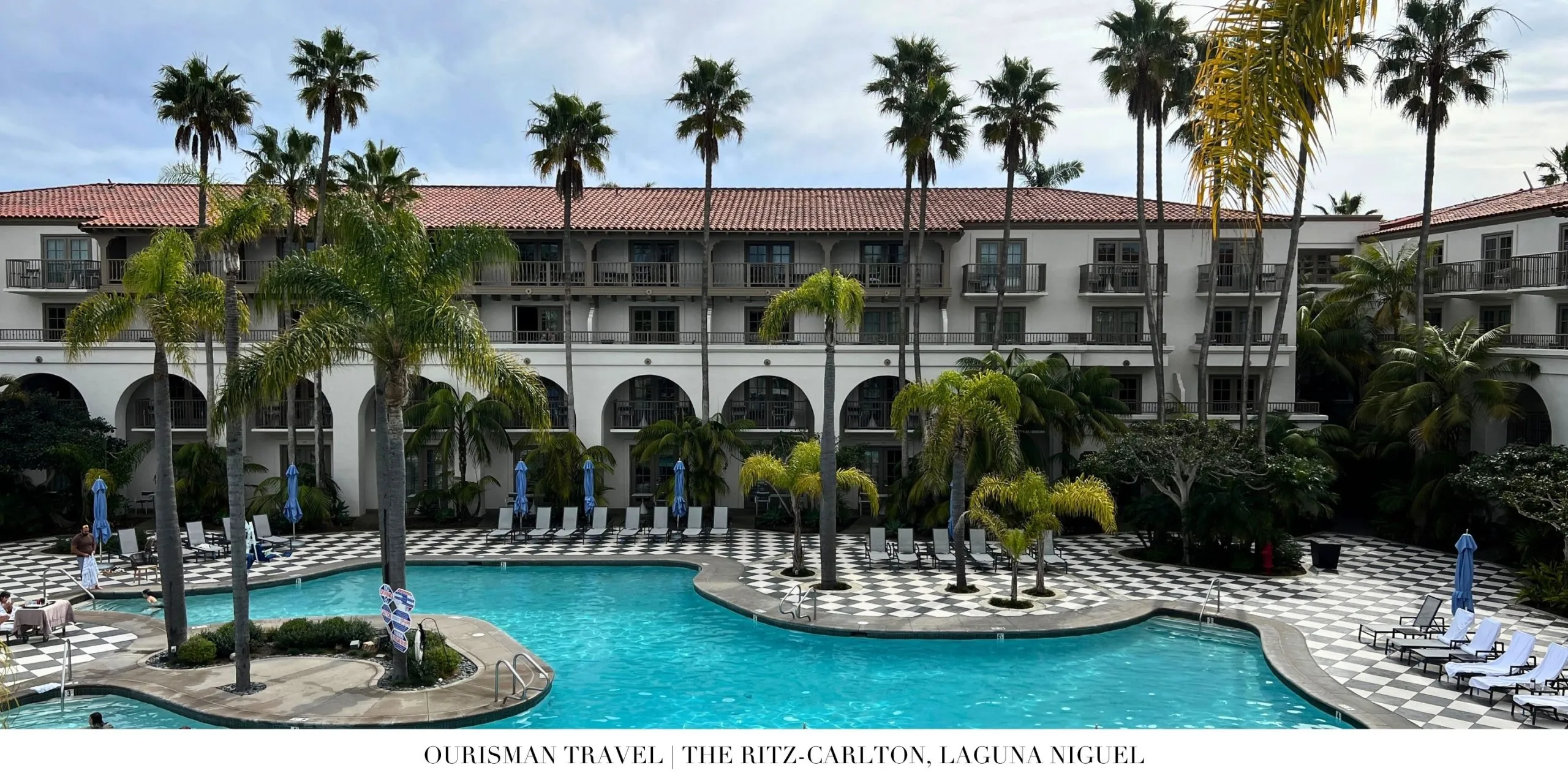 Relaxed pool area at The Ritz-Carlton, Laguna Niguel with landscaped setting