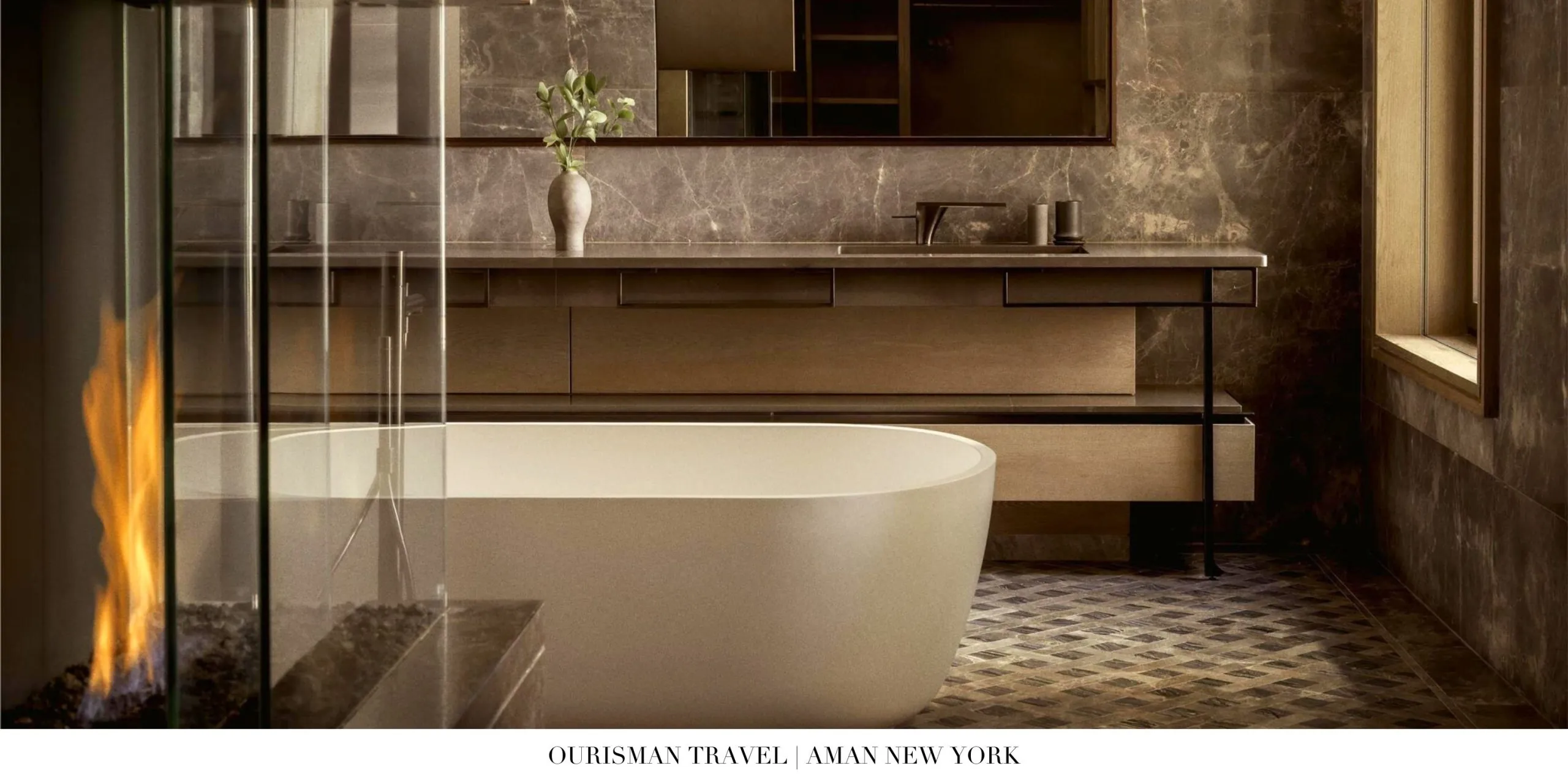 Marble bathroom with spa-style amenities at Aman New York