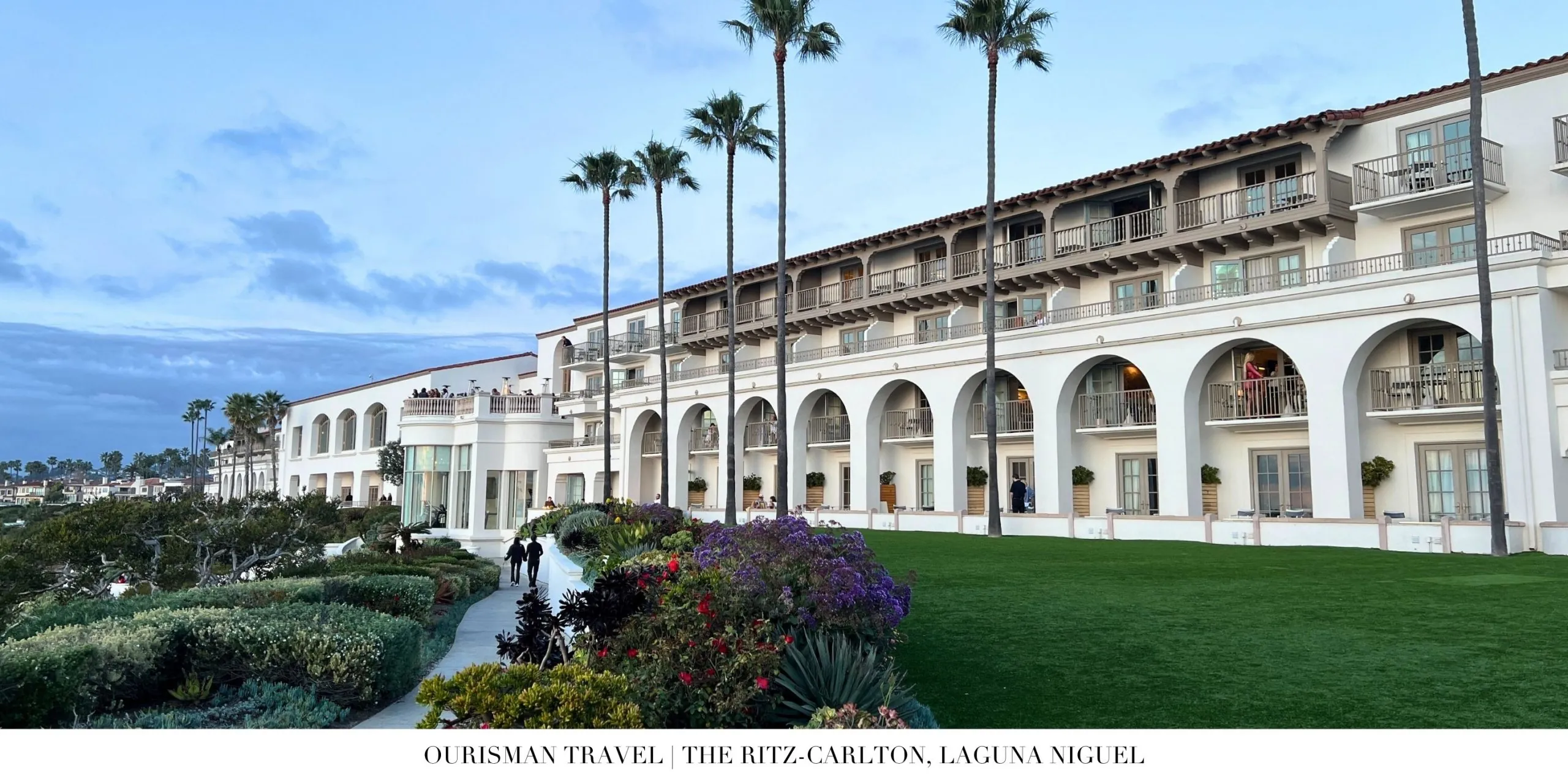 The Ritz-Carlton, Laguna Niguel exterior at dusk with glowing lights