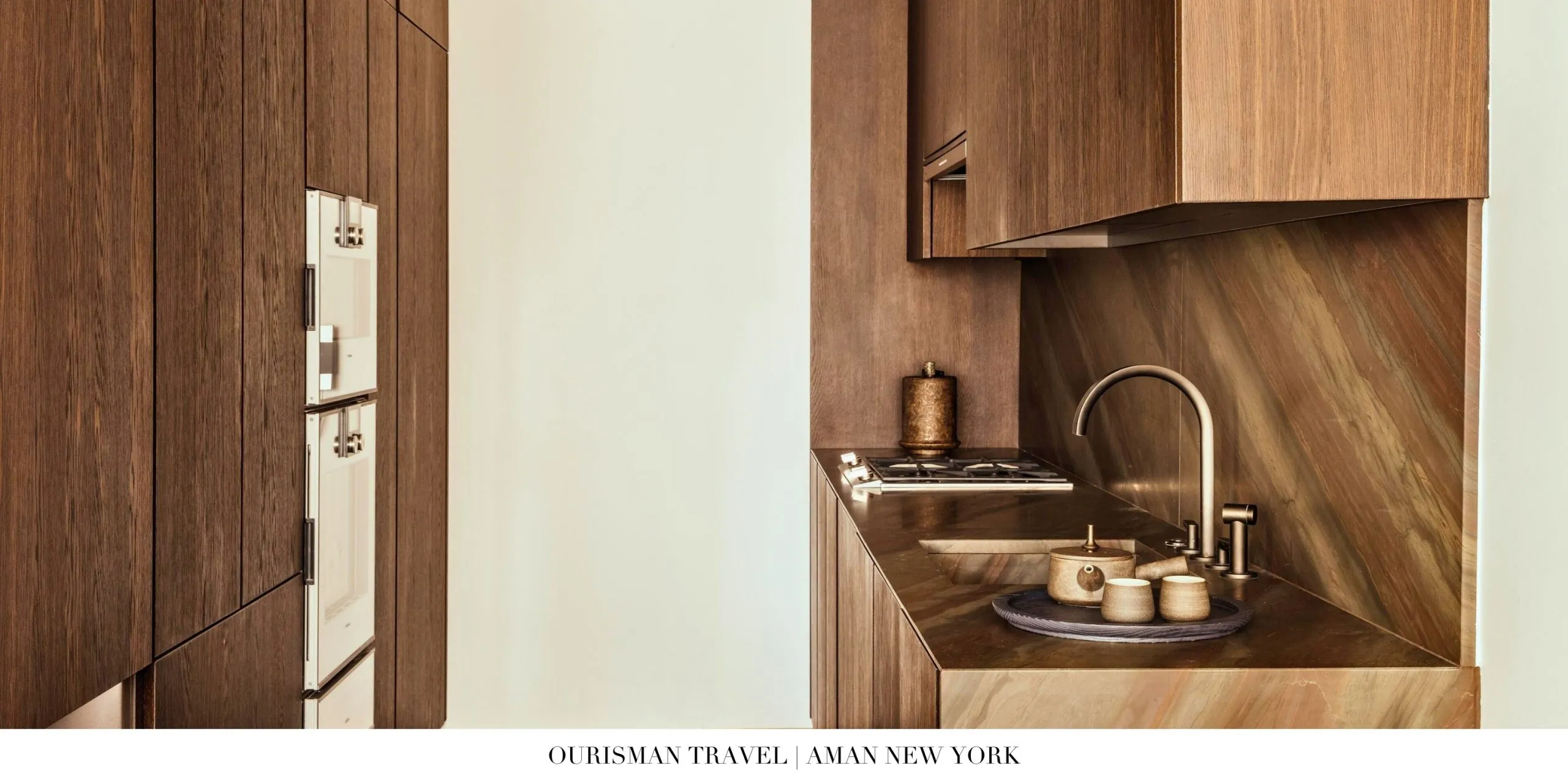 Contemporary suite with modern luxury finishes and kithcen at Aman New York