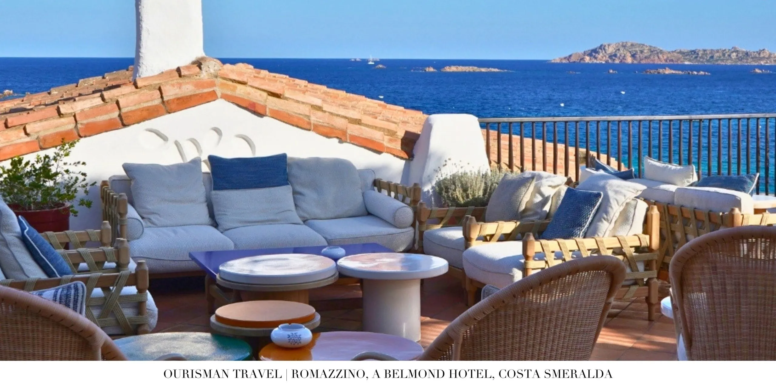 Outdoor terrace seating at Romazzino Belmond with panoramic sea views