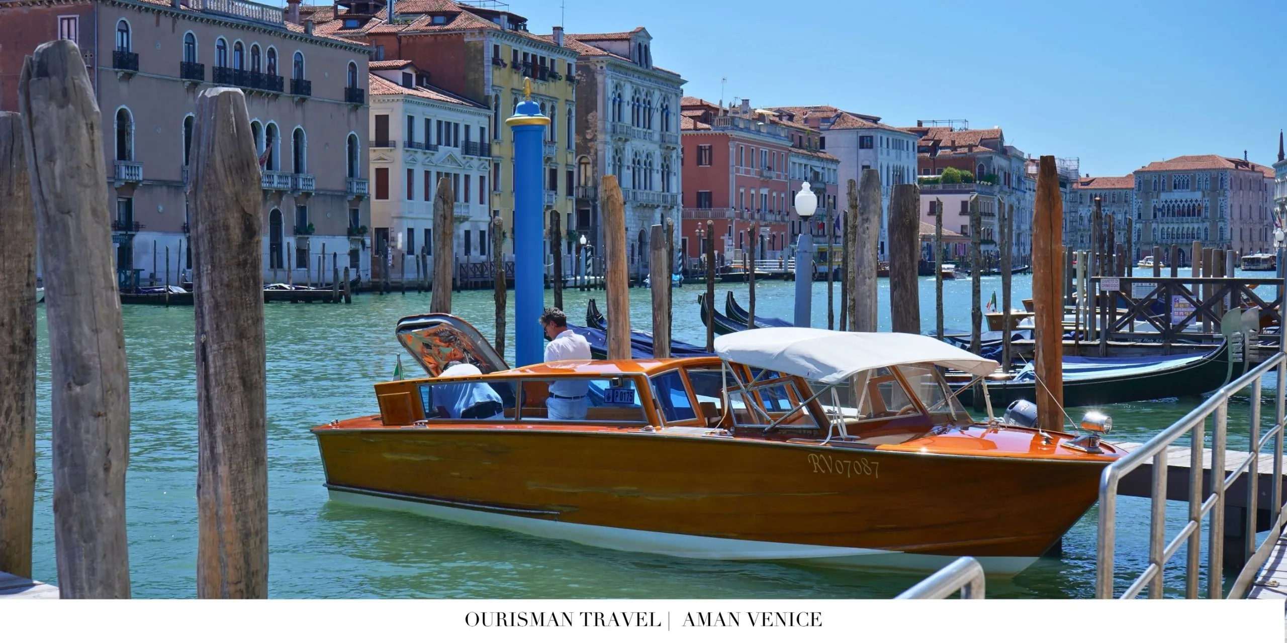 Aman Venice waterfront scene with traditional gondolas