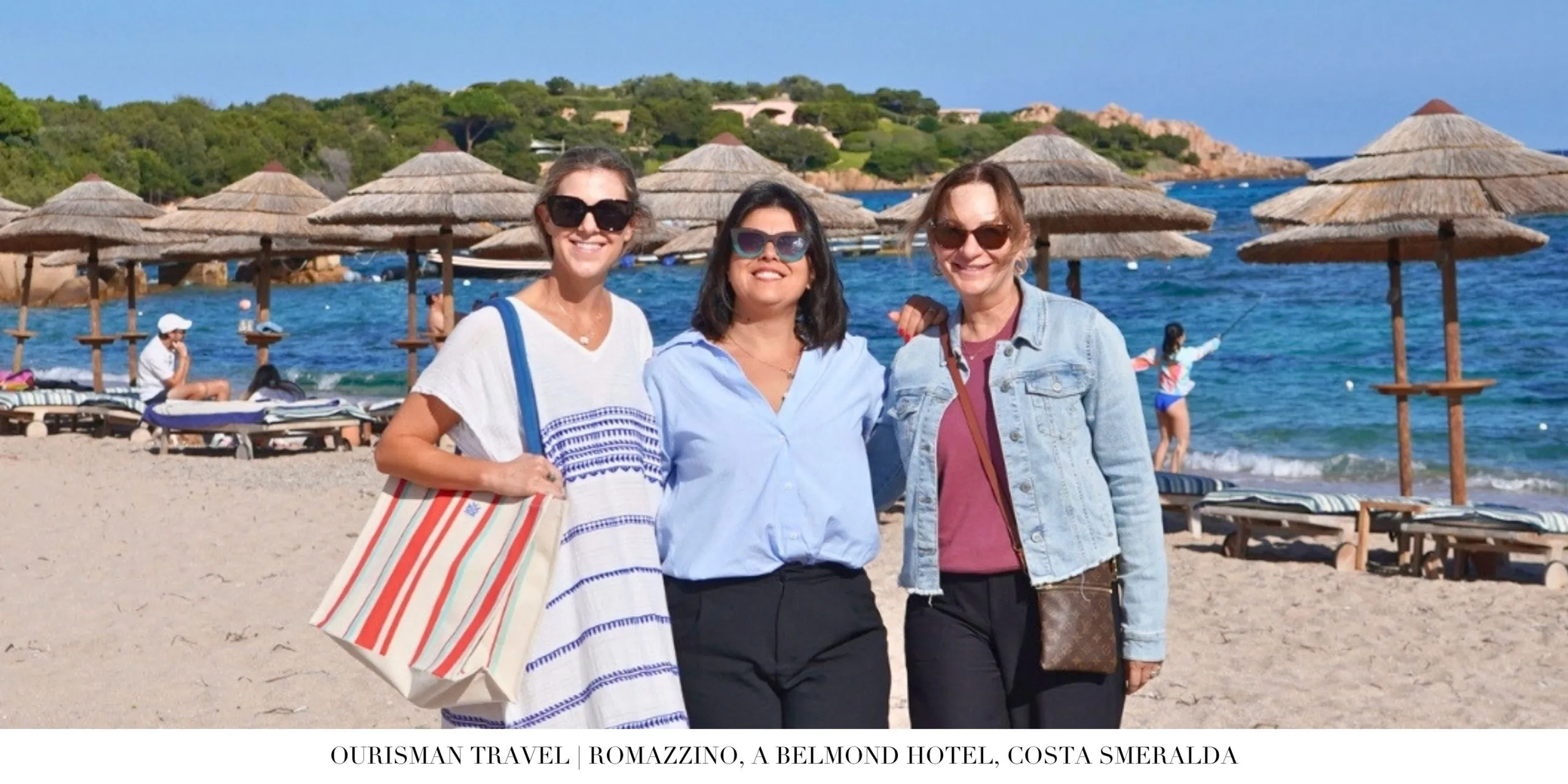 Ourisman Travel enjoying the beach at Romazzino, A Belmond Hotel along Spiaggia del Romazzino with calm turquoise water and soft white sand backdrop