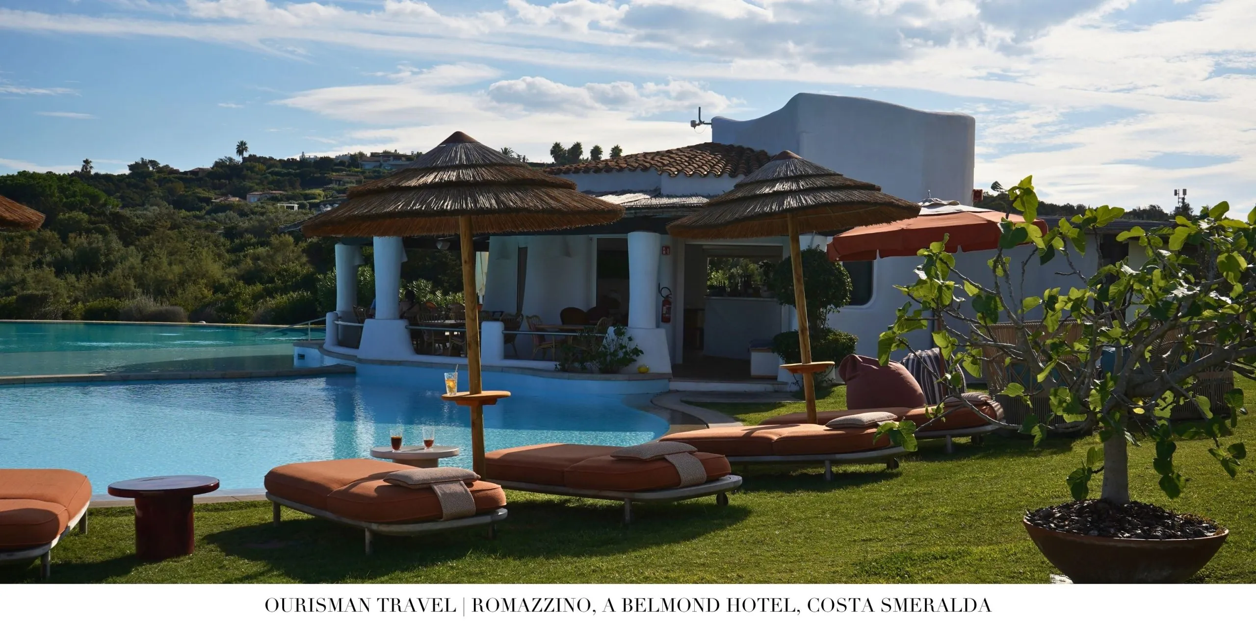 Poolside relaxation area at Romazzino Belmond with Mediterranean design accents