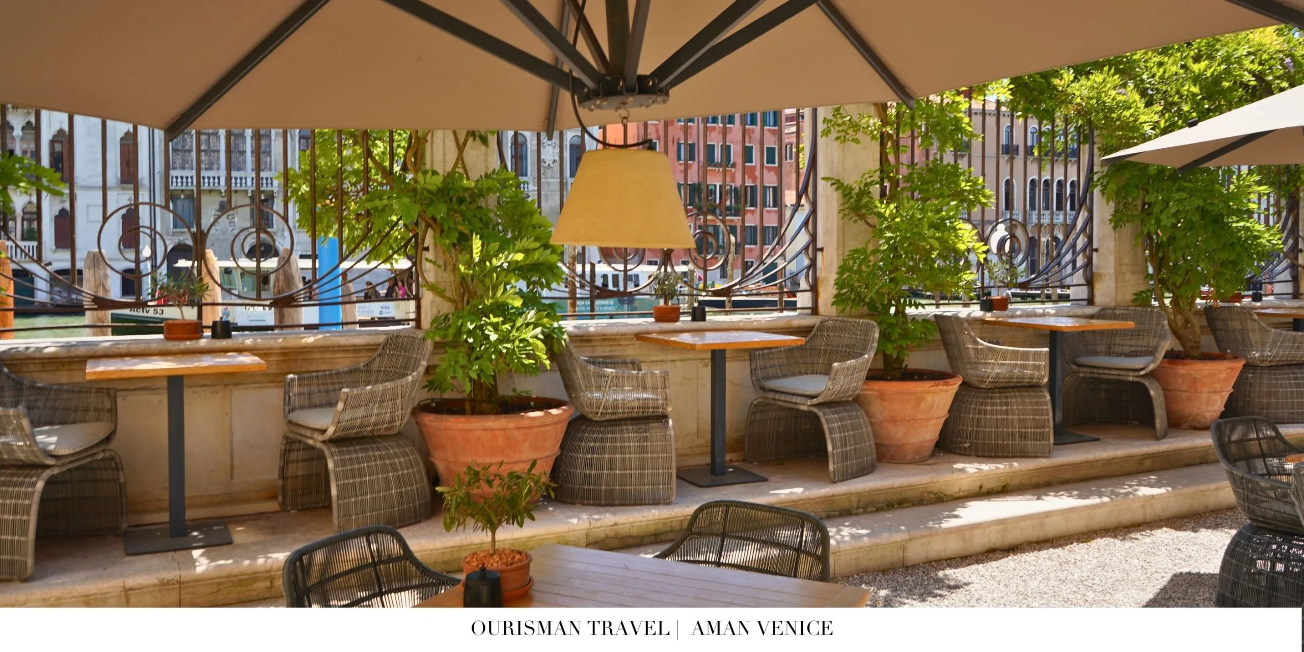 Aman Venice common areas with elegant seating and bar ambiance