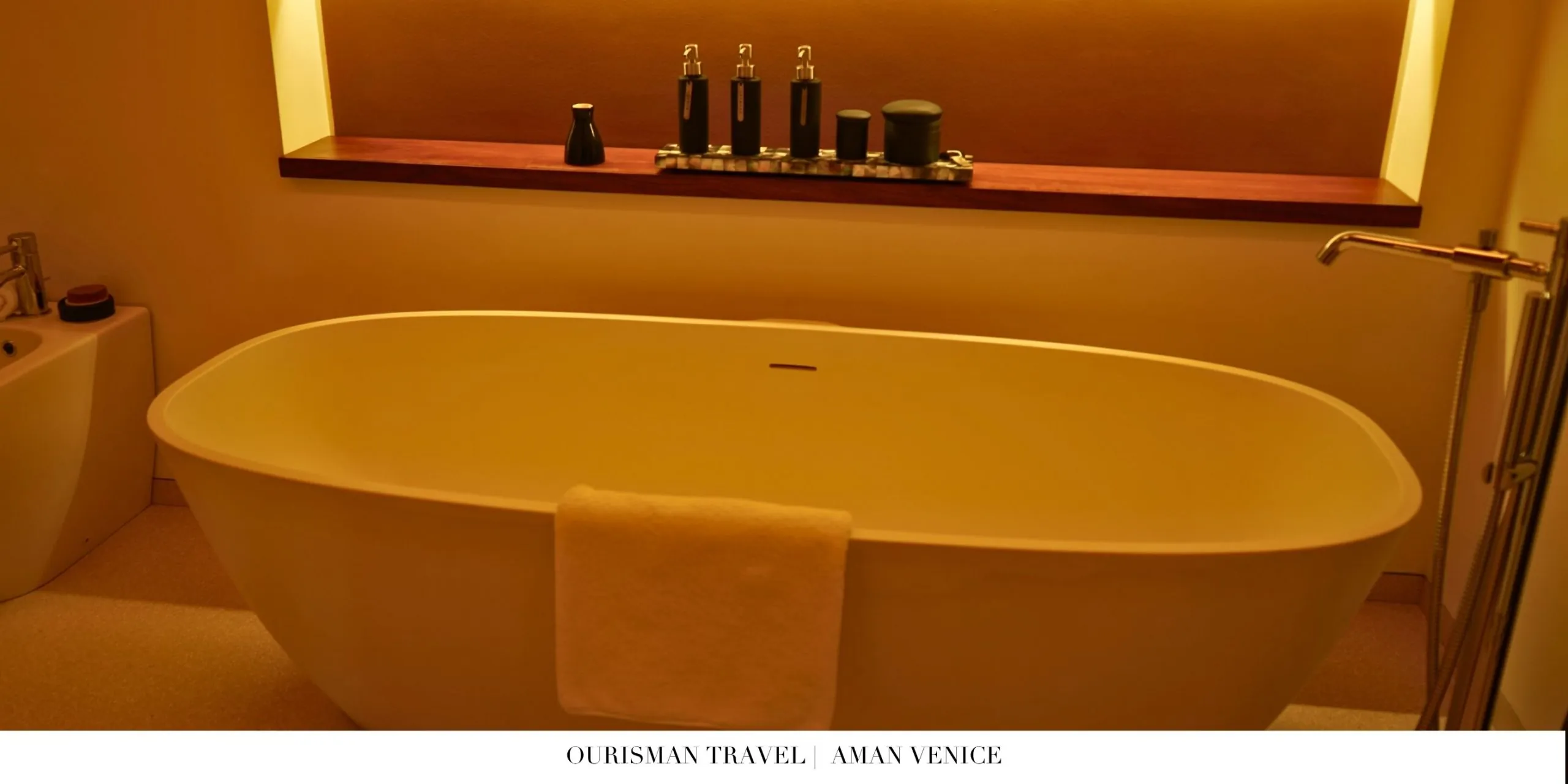 Luxurious bathroom at Aman Venice with soaking tub and elegant details