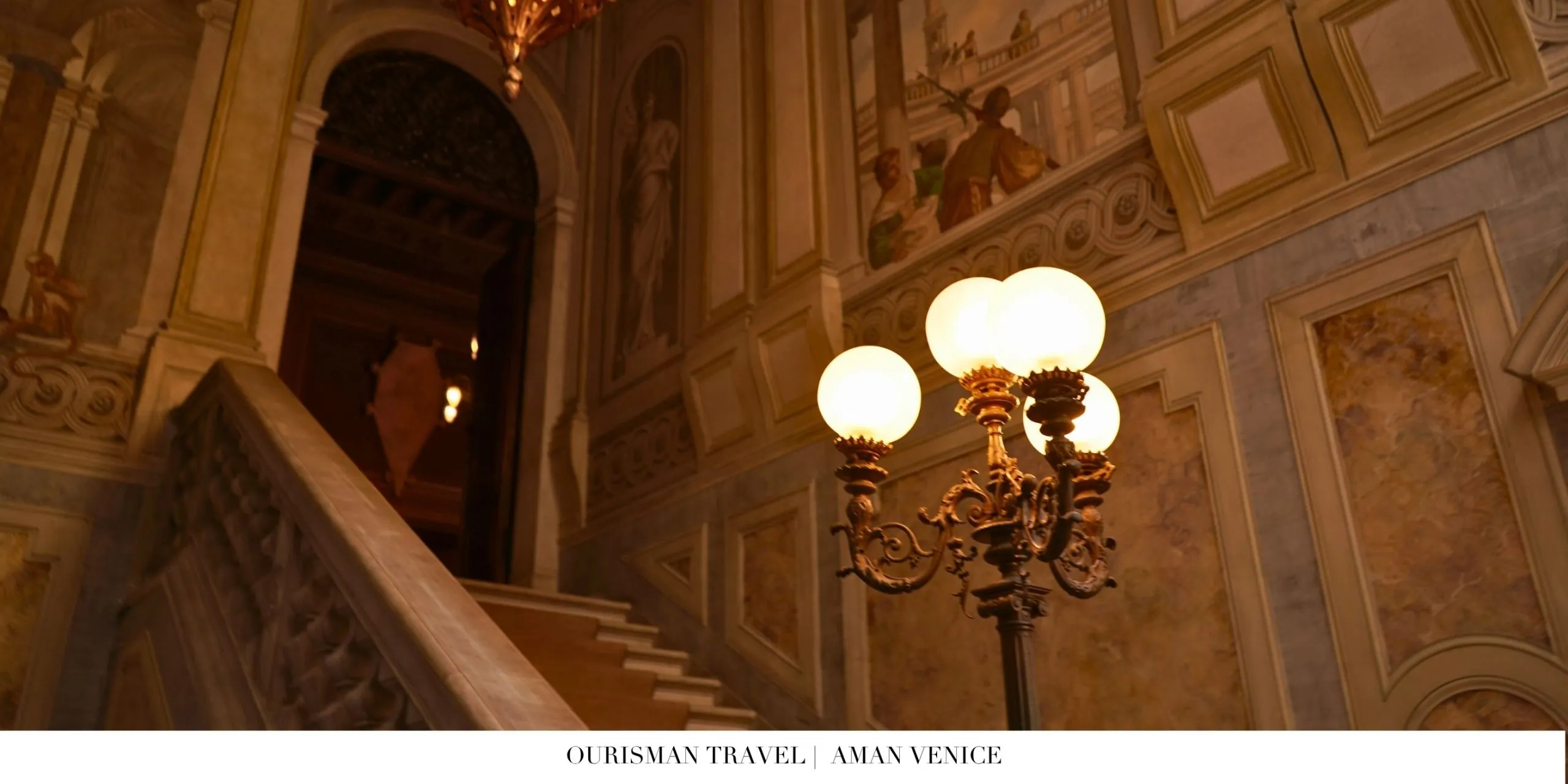 Elegant lobby at Aman Venice featuring original Italian frescoes