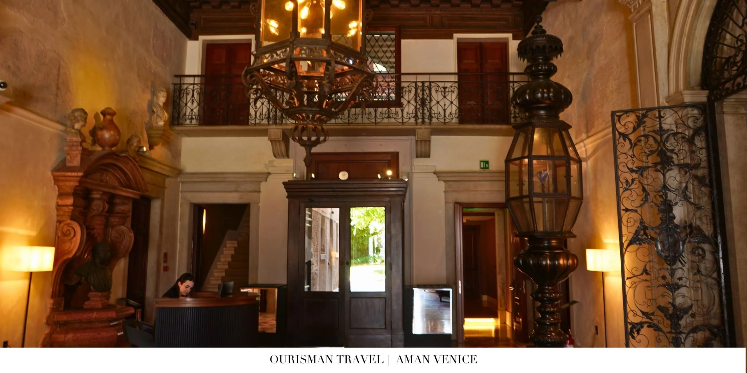 Aman Venice lobby with frescoed ceilings and historic artwork