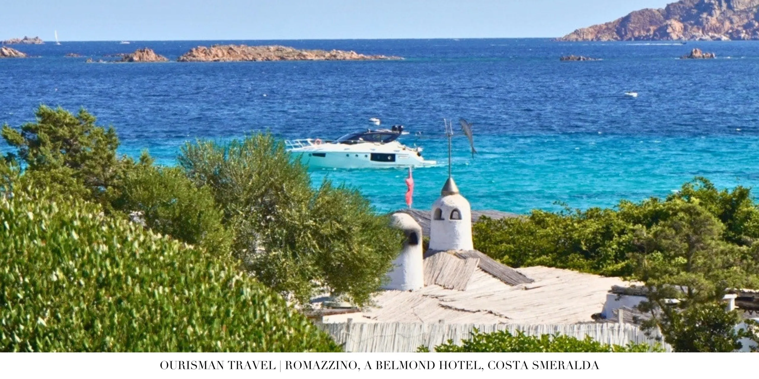 Beachfront view of Romazzino Belmond framed by Mediterranean vegetation