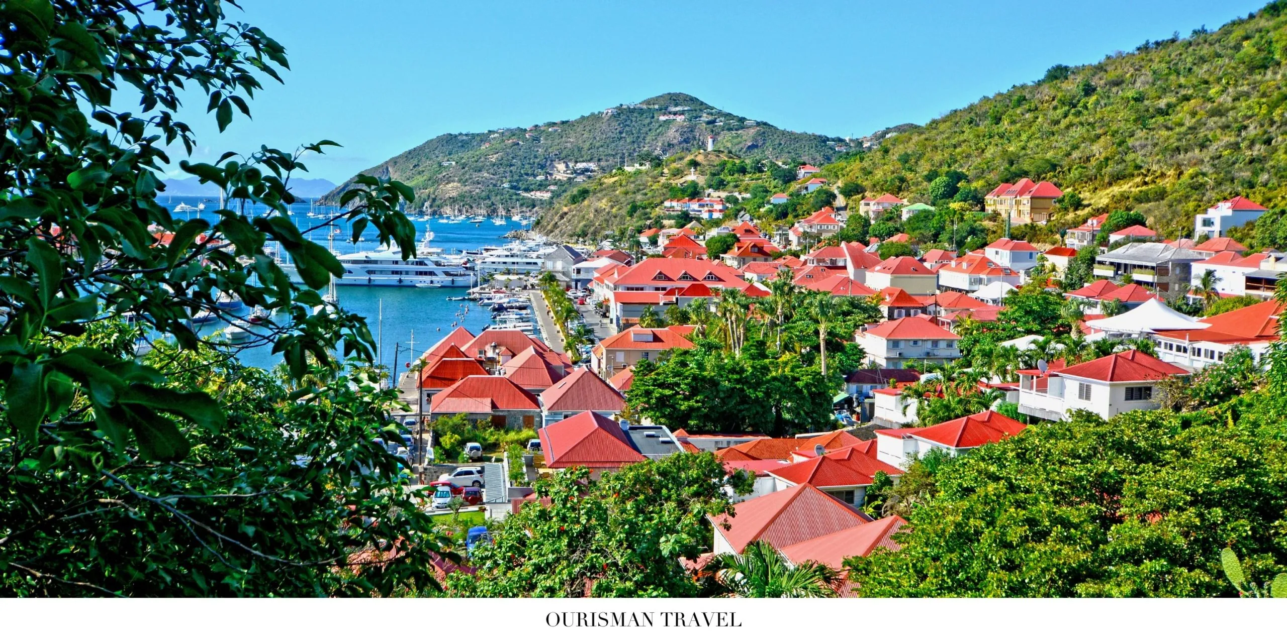 Luxury beach scene in St. Barth with turquoise Caribbean waters and white sand coastline