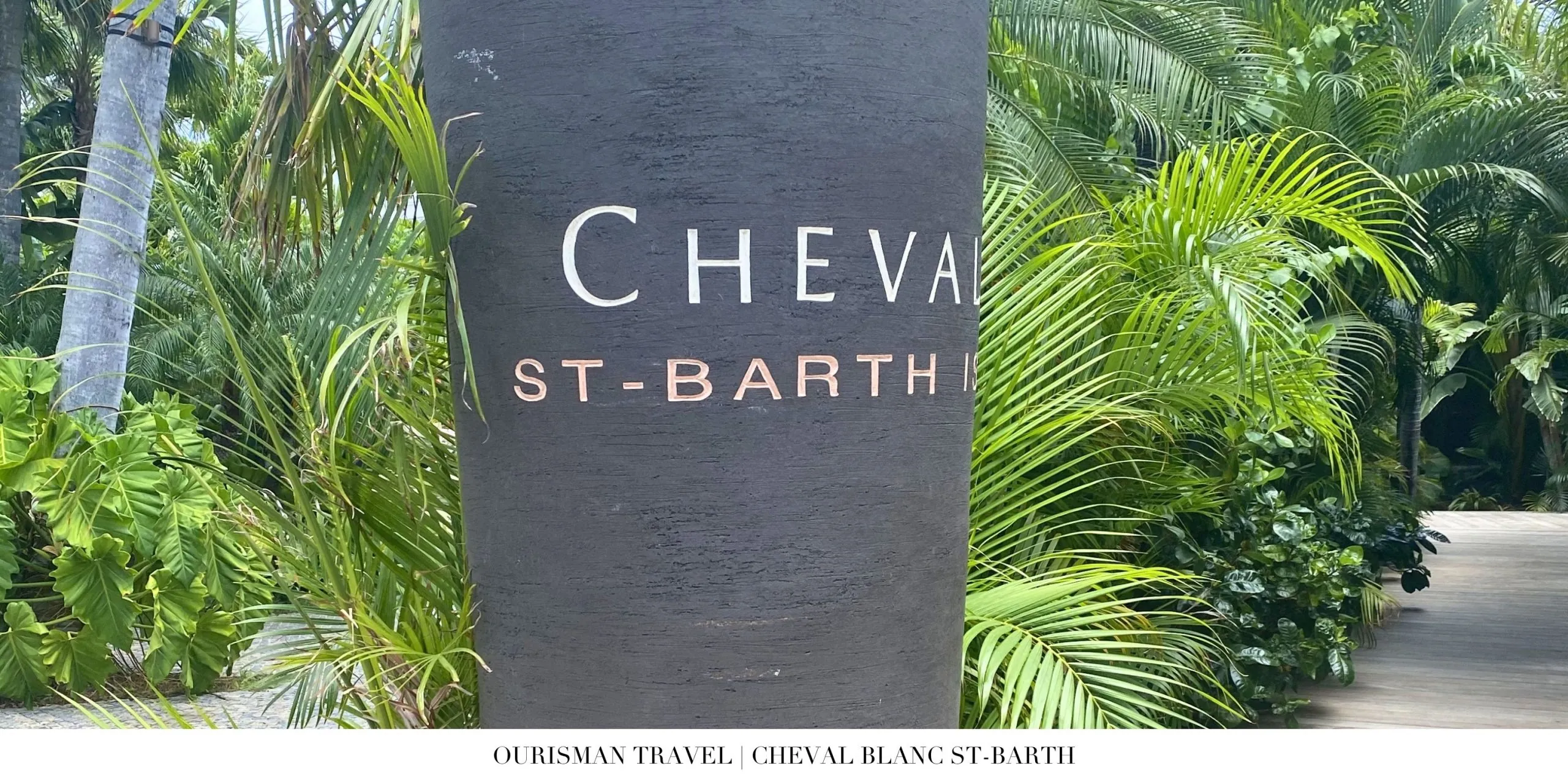 Cheval Blanc St-Barth resort entrance sign surrounded by tropical landscaping