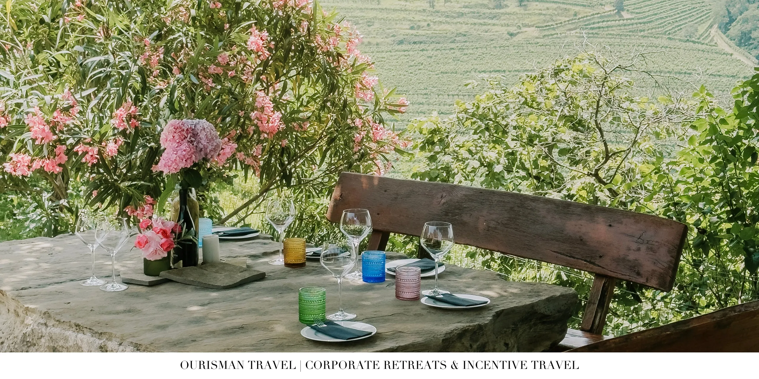 Outdoor dining table overlooking vineyards in a wine country destination