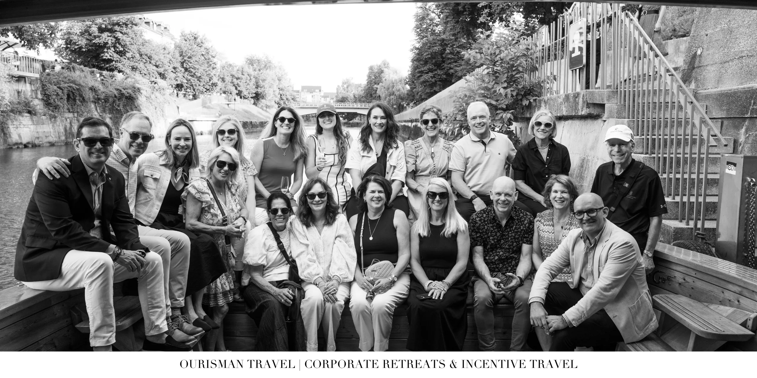 Corporate retreat attendees gathered for a group excursion on a canal boat