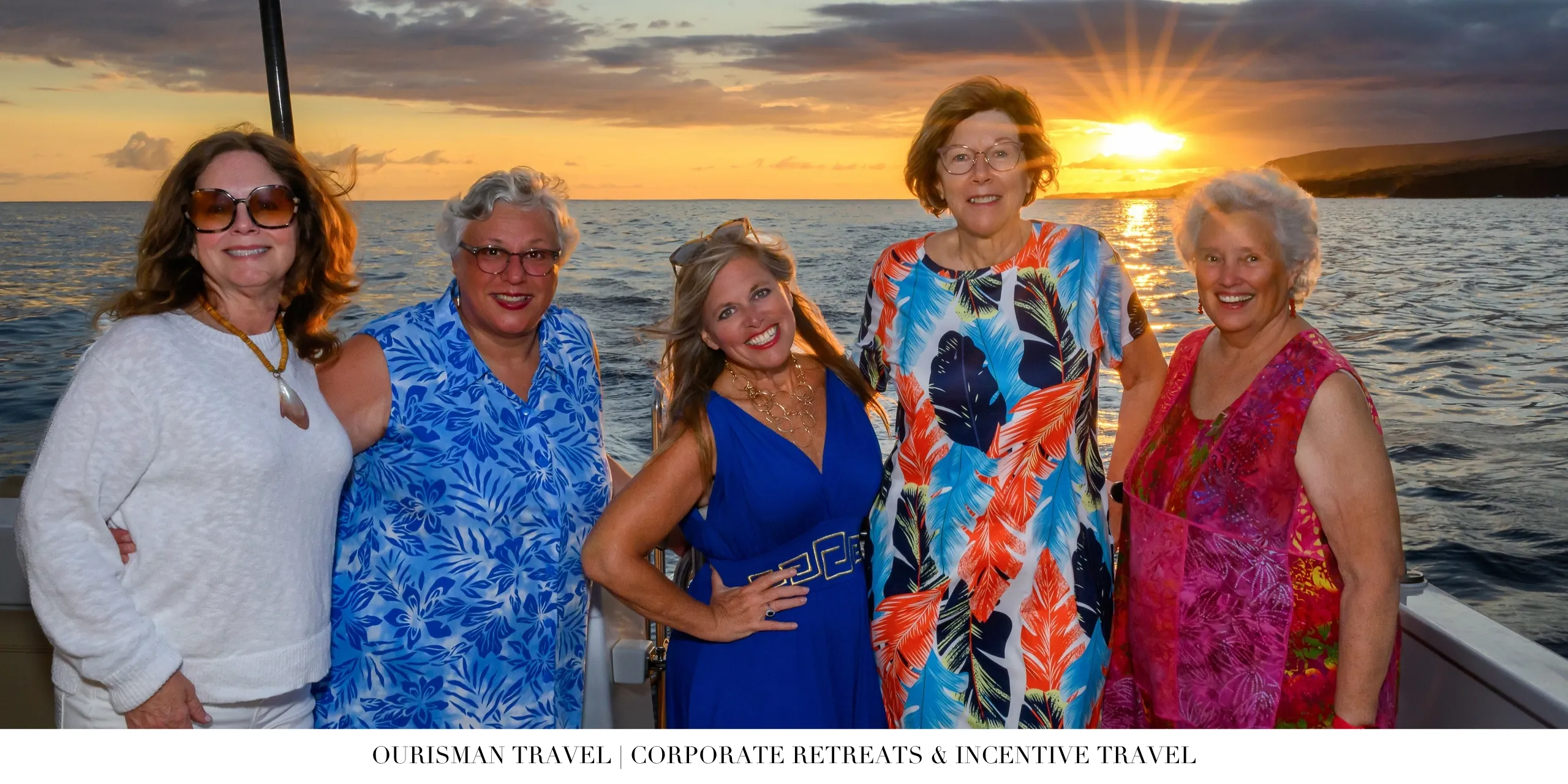 Corporate retreat attendees enjoying a sunset cruise during an incentive travel program