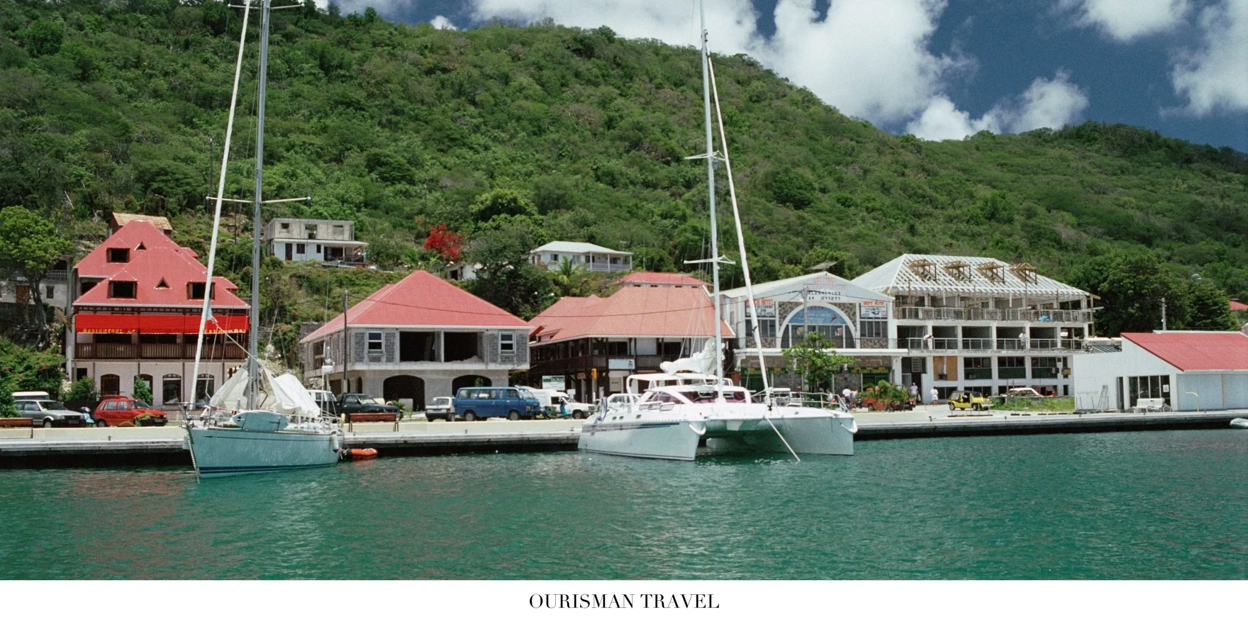 Elegant harbor in Gustavia, St. Barth, lined with superyachts and waterfront boutiques