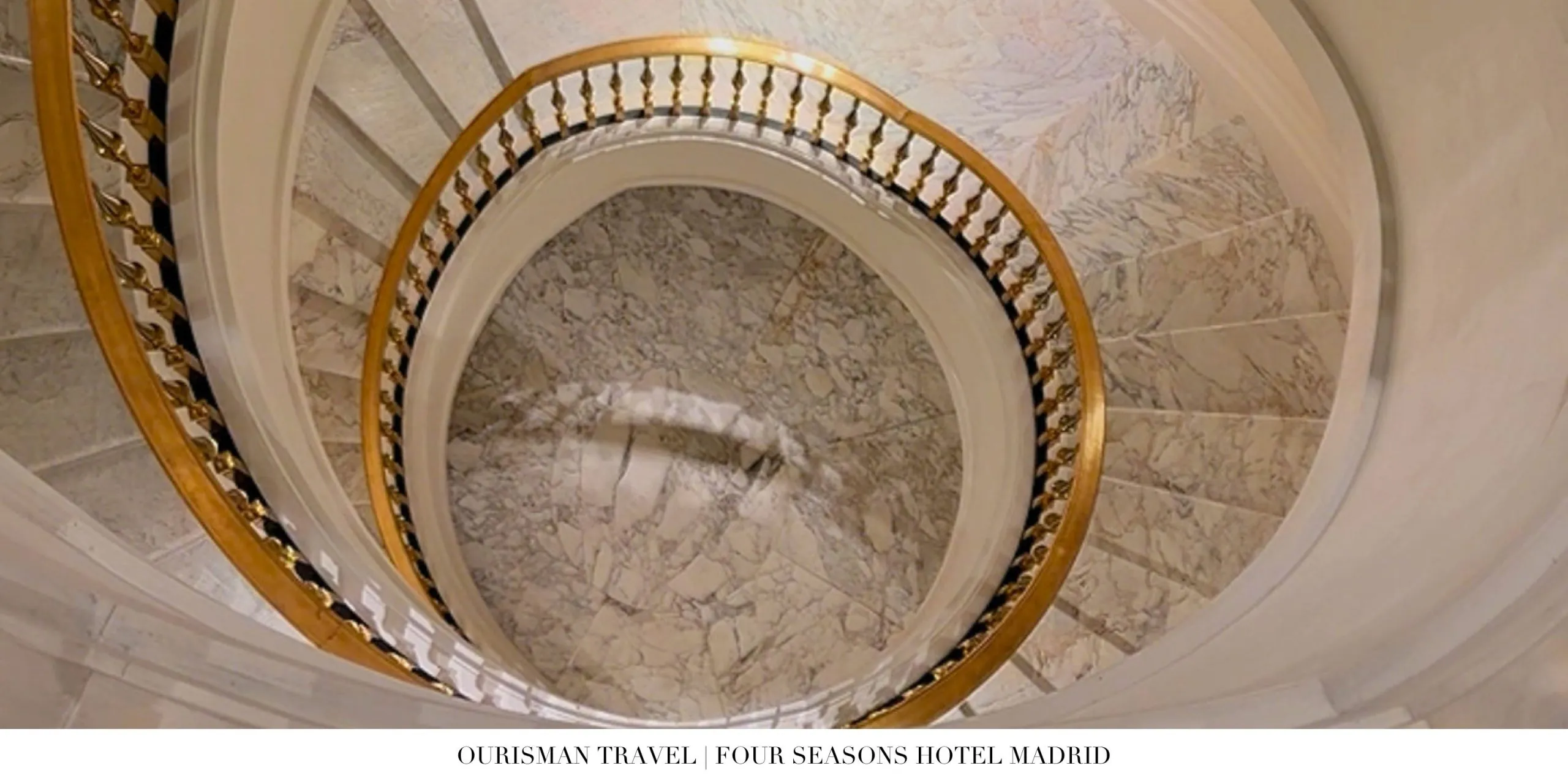 Historic marble staircase at Four Seasons Madrid