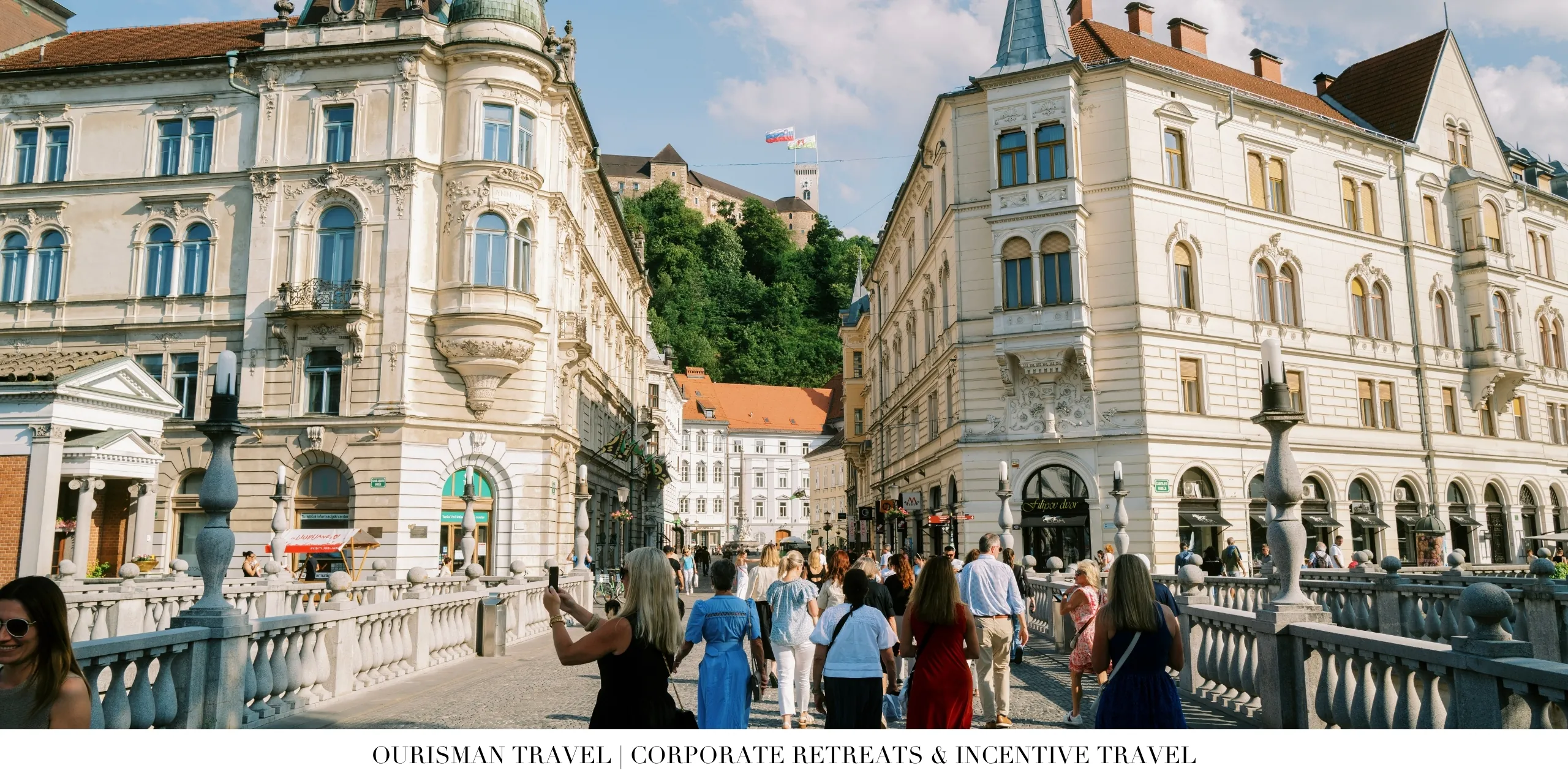 Corporate retreat attendees exploring a historic city during a group excursion