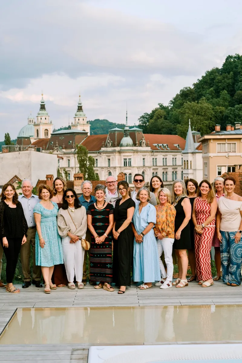 Corporate incentive travel attendees at a rooftop event overlooking Ljubljana, Slovenia