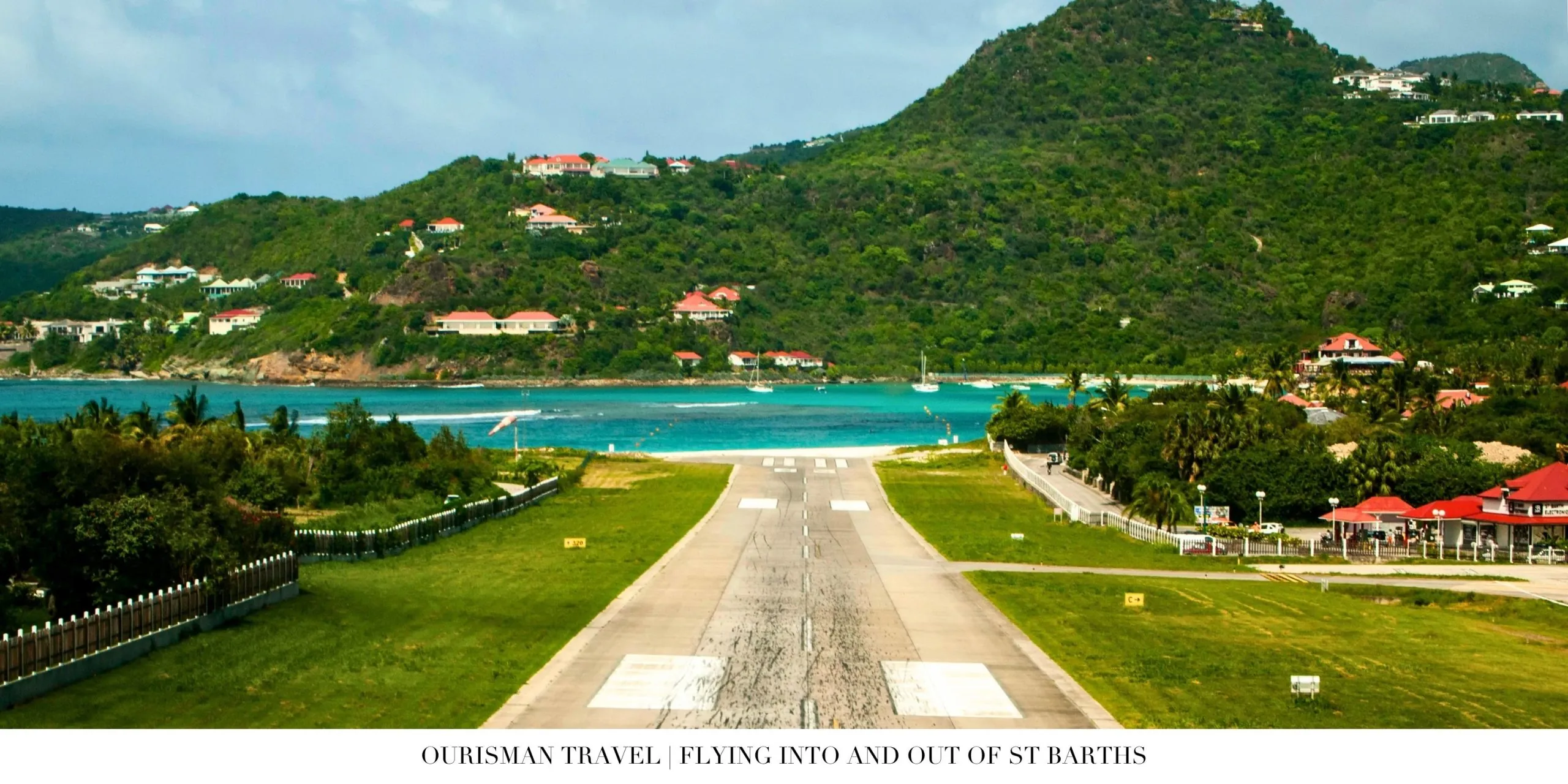 Aircraft approaching the iconic runway in St. Barth surrounded by tropical hills