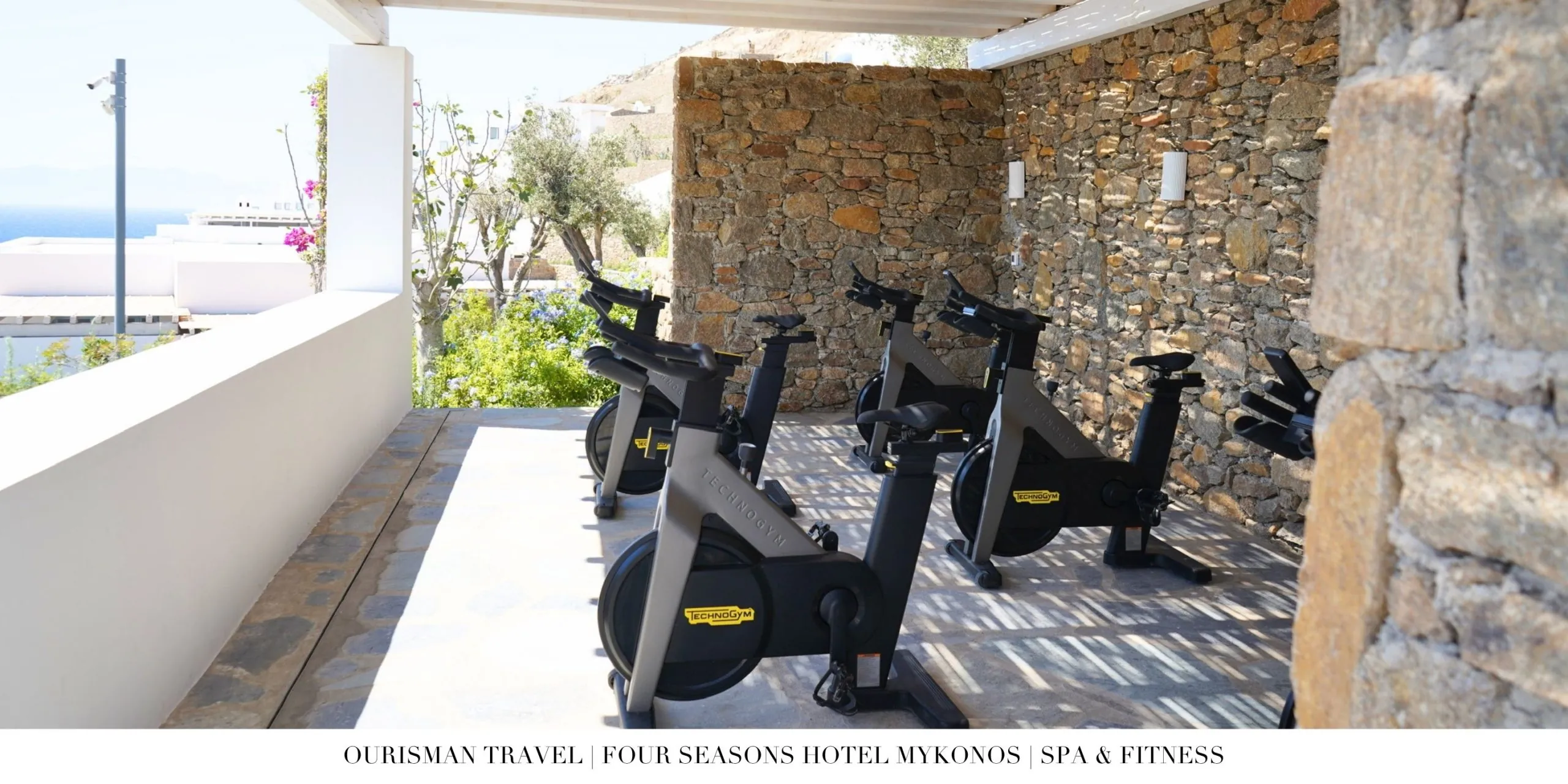 Peloton bikes in the outdoor fitness pavilion at Four Seasons Mykonos