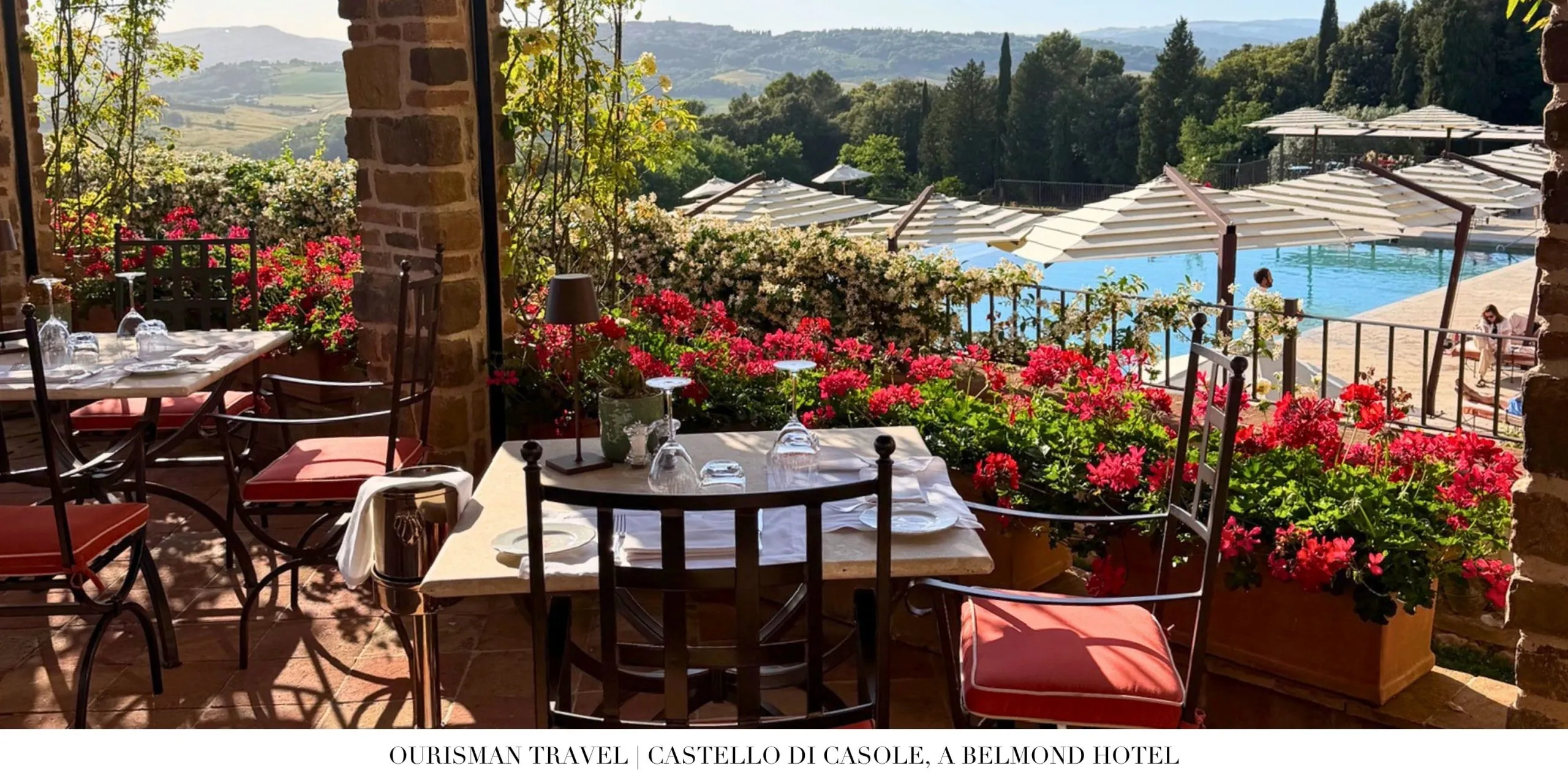 Outdoor dining terrace at Emporio Terrace Castello di Casole overlooking the Tuscan countryside.