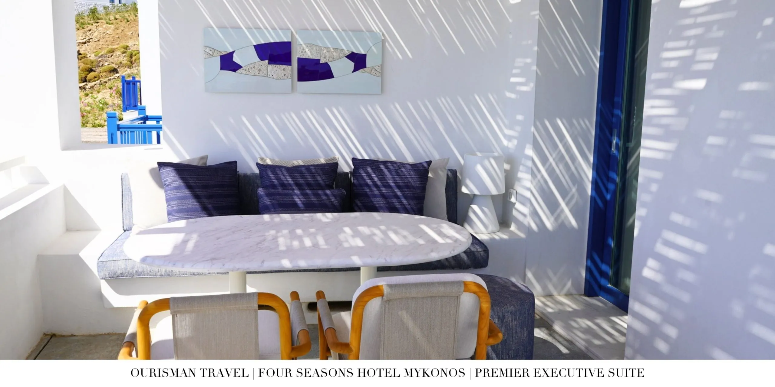 Outdoor seating on the Premier Executive Suite terrace at Four Seasons Mykonos