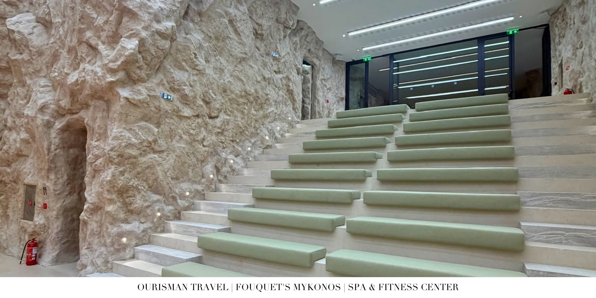 Fouquet’s Mykonos rock-carved basketball court seating