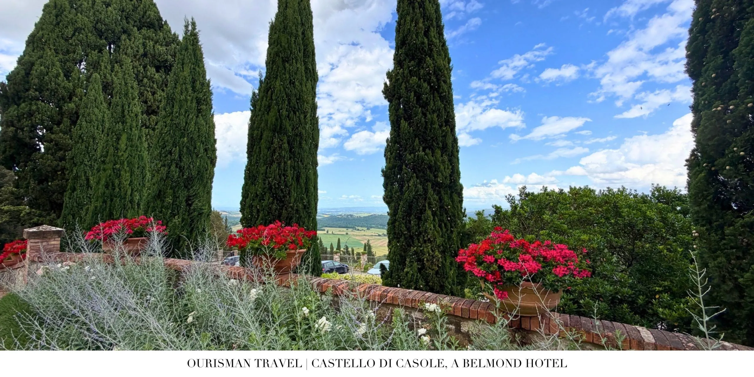 Cypress trees and gardens at Castello di Casole, a Belmond Hotel in Tuscany.