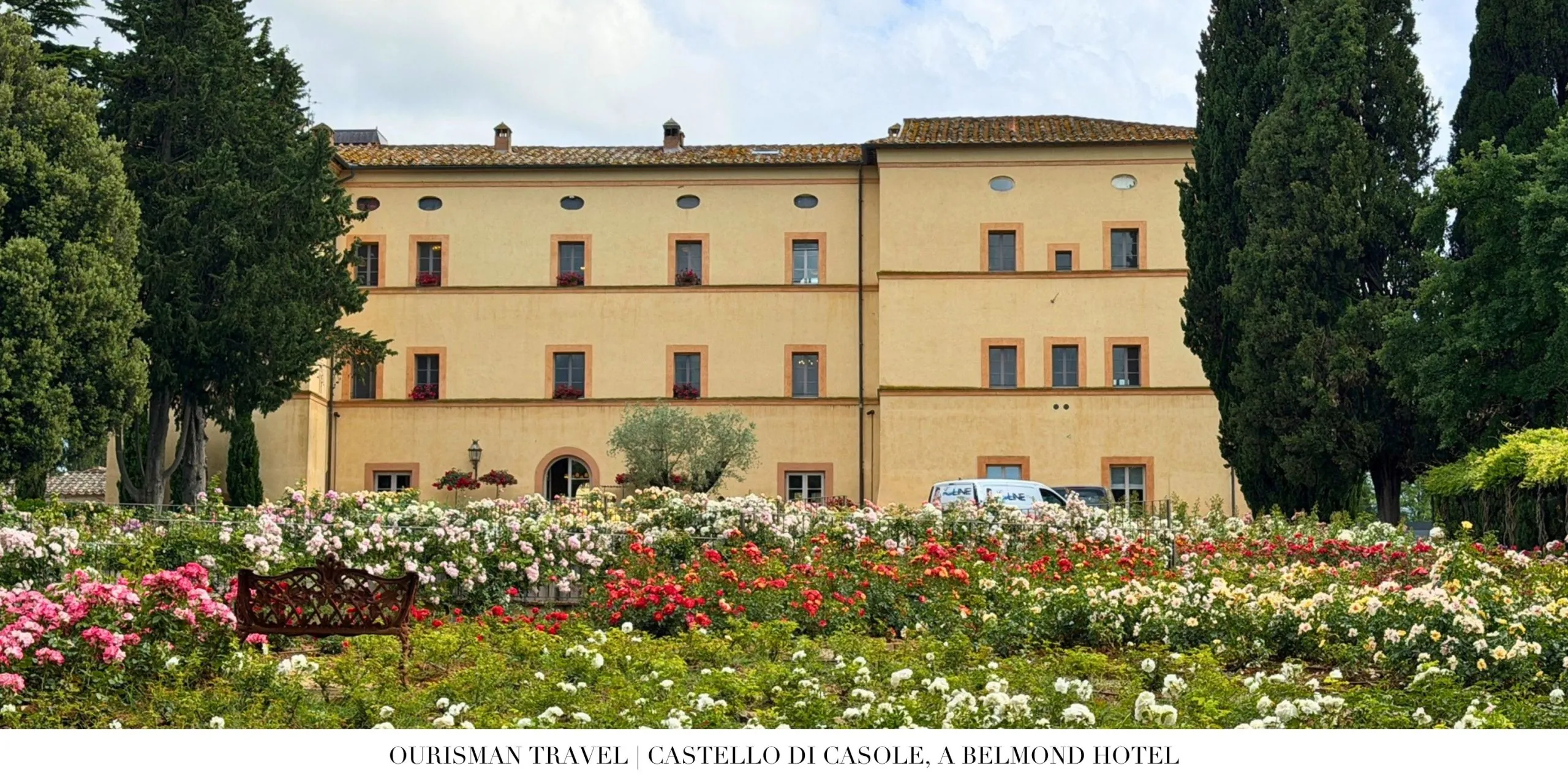 Historic exterior of Castello di Casole, a Belmond Hotel, surrounded by gardens in Tuscany.