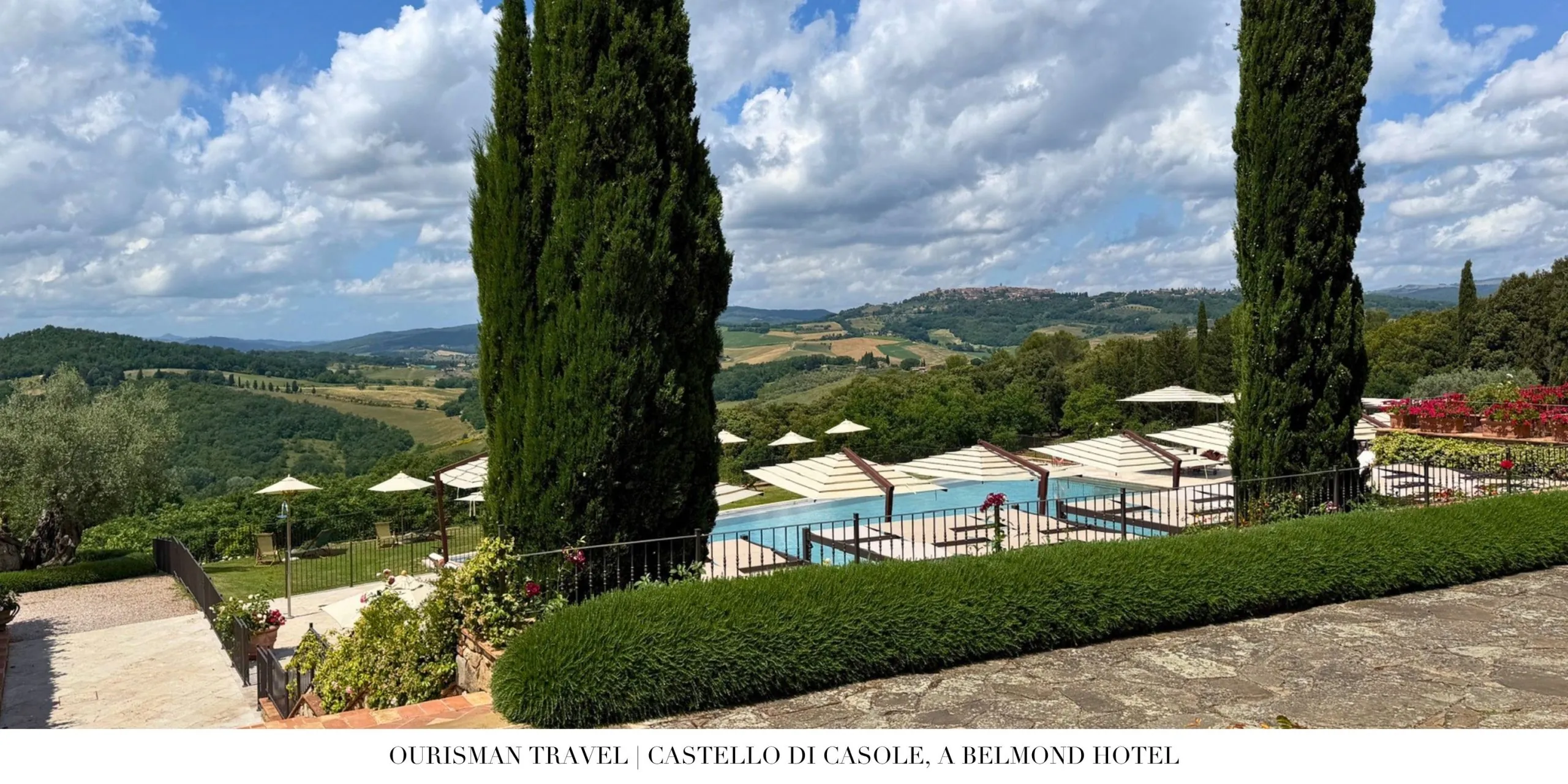 View of the infinity pool and Tuscan countryside at Castello di Casole.