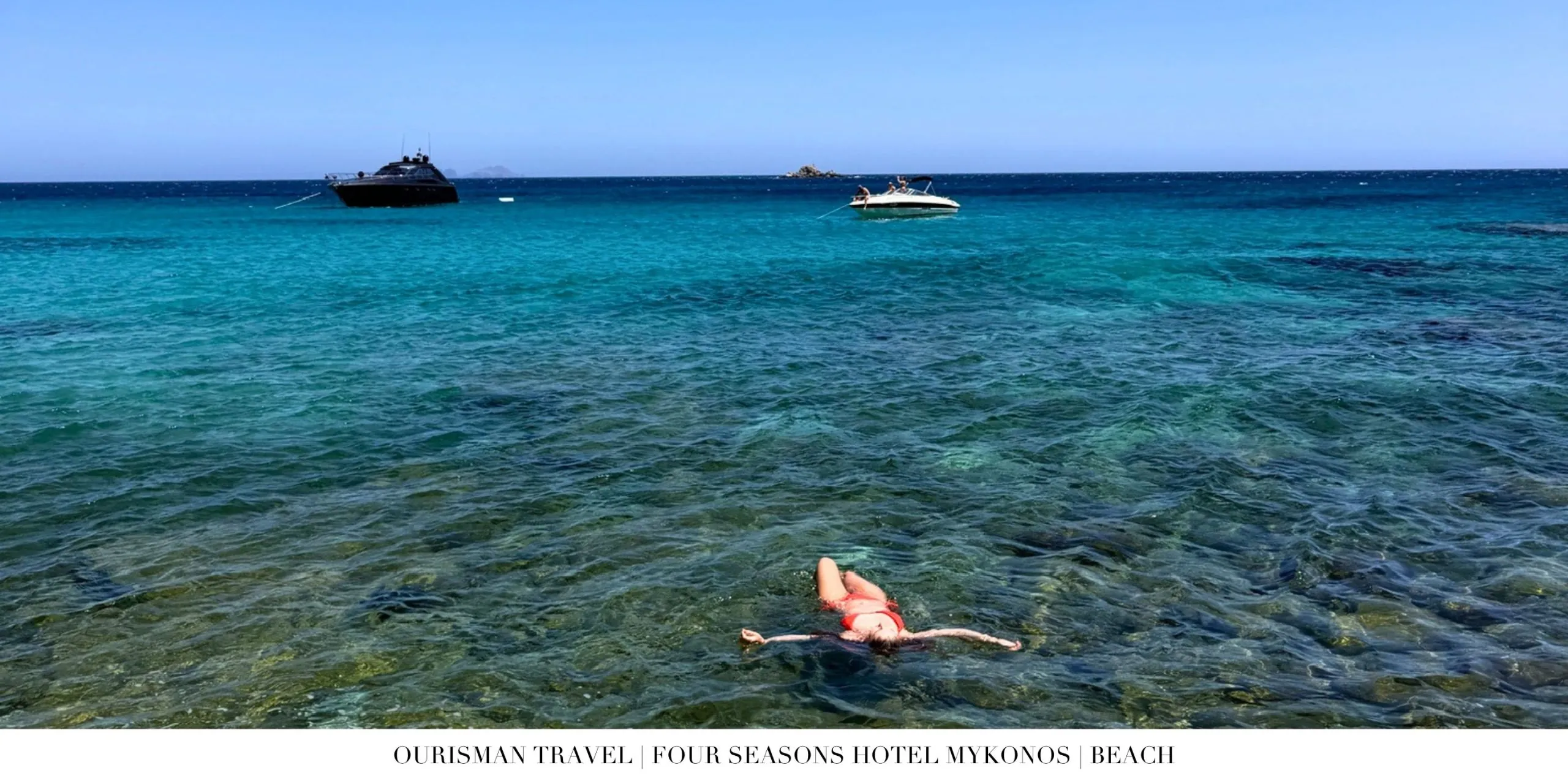 Swimming in the private beach cove at Four Seasons Mykonos