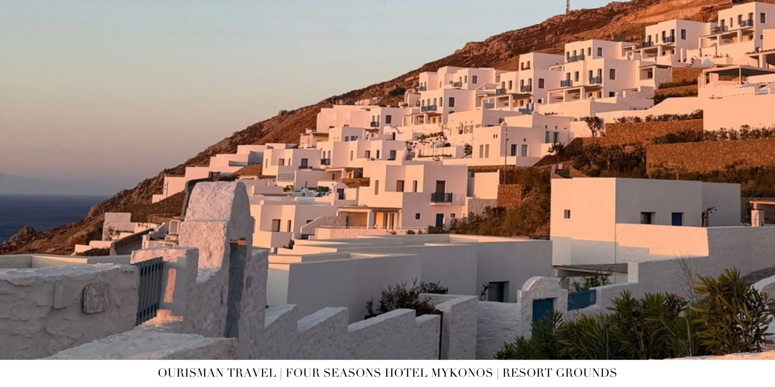 Whitewashed buildings at Four Seasons Mykonos overlooking the Aegean Sea