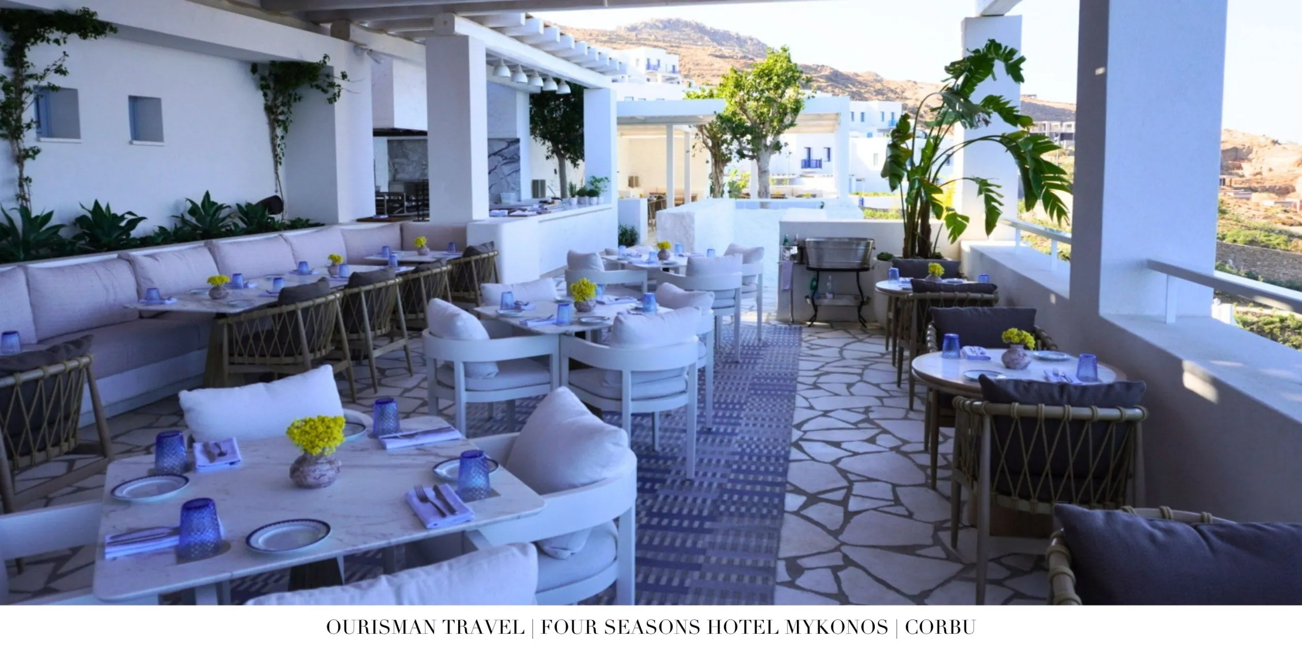 Outdoor dining terrace at Corbu restaurant at Four Seasons Mykonos